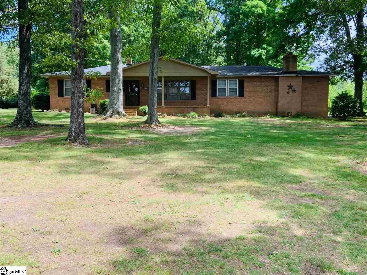 Call today for a personal showing of the 3 bedroom brick home in Pelzer! Walking distance from the Elementary school! Anderson School District One Schools! Sit around at the cozy fire place in the spacious living room. This home features an attached carport and detached 2 car garage with 1 acre of land!