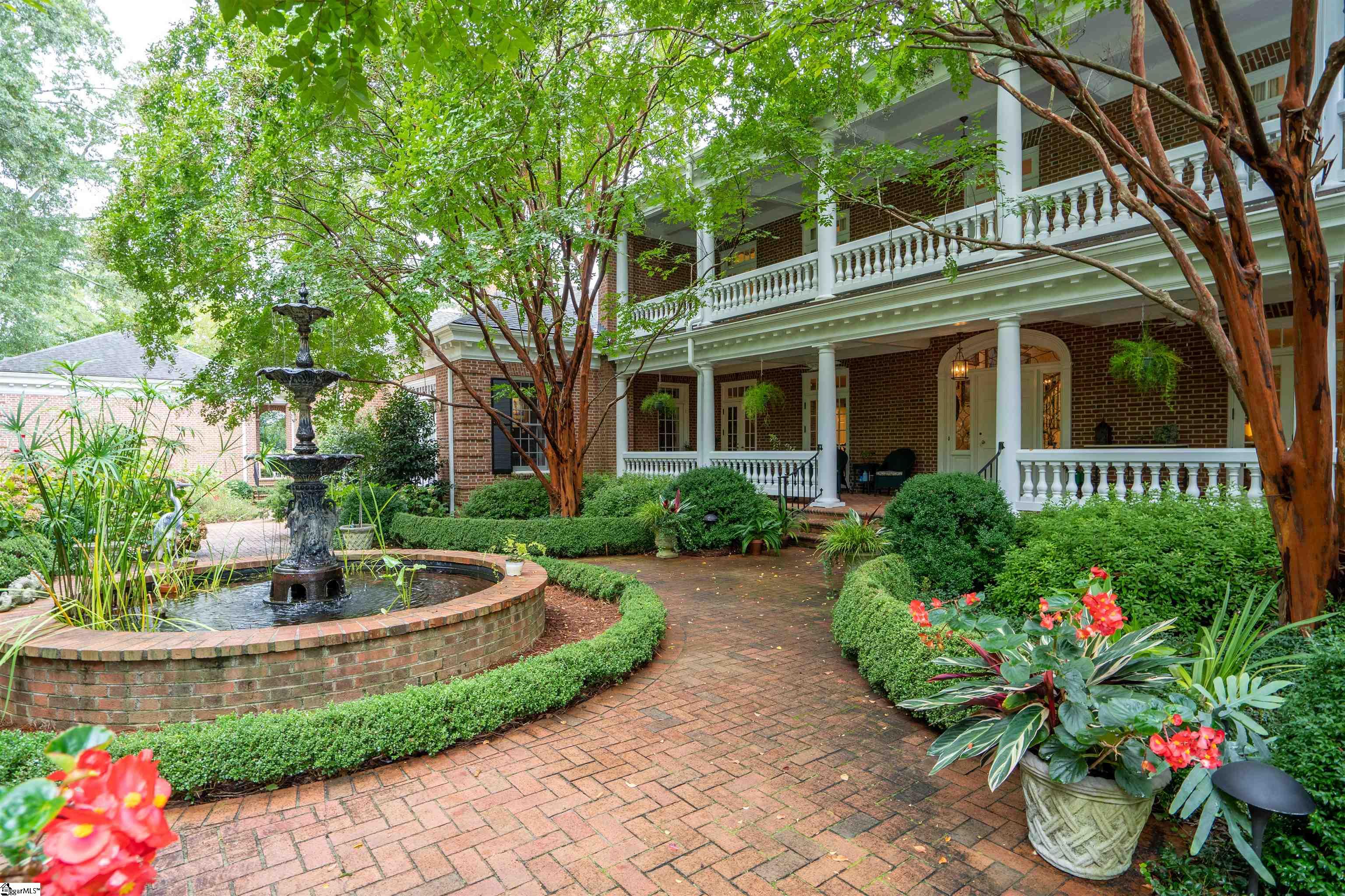 Authentic Charlestonian on Crescent Avenue, finest street in “old Greenville.” Designed by architect Harold Mack ‘89. Covered porches, private walled courtyard & abundant gardens center around fountain, a year round gathering space. Exquisite features: 10’ ceilings, beautiful hardwoods, custom “floating” staircase, three fireplaces, mahogany paneled Den, walk-in wet bar, spacious granite Kitchen, grand Dining room. 1st flr master wing w/study, separate His & Hers baths, dressing rooms, multiple closets. Upstairs: 2 bedroom suites, & huge walk in attic with icynene insulation, great expansion potential. Sellers added full apartment w/Ktchn, laundry & study above 3 car garage. Front & back driveways. 24 hr notice & VOF required. SOLD COMPS: 810 Crescent, 111 Boxwood, 412 Crescent