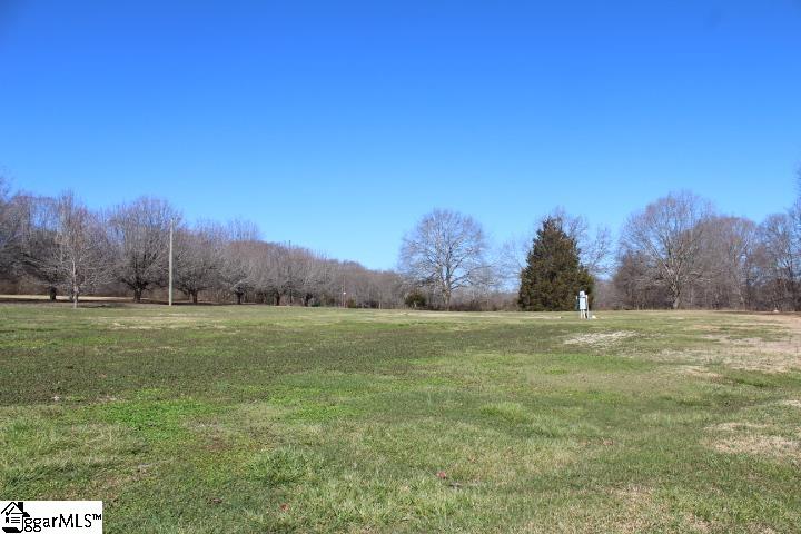 1.88 Acres located steps away from Southern Oaks Golf Course and minutes from Wren Schools!  Bring your builder and quiet country dreams to see this level, grass covered lot with pasture view.  Septic tank and power are on site to expedite your new build.   A small storage building with power that seller will remove before close should you choose as well as a large carport with power that is currently being used for a shop is included with the sale.  A covered well is located on site but a new well will be needed to support a home.  City water is not currently available at the road, but nearby homes do have city water connected.  Easement drive on left side of property for neighboring home and lot behind.  Only restriction is no mobile homes, modular homes are okay.  Come out and see 148 Southern Oaks Drive today!  Shown by appointment only!