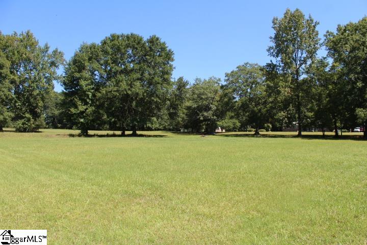 Beautiful level 1.26 acres just outside on Belton City limits is ready for you to build your dream home.  Come take a look at this well-kept lot that will make you feel like you are at a park with its mature oaks to provide some shade, and lush green grass.  Given the size of the lot, division and multiple homesites may be approved by county.  No current known restrictions, but Seller will place deed restrictions of no mobile homes and minimum home size of 1,100 square feet at closing.  Modular homes are allowed.  Additional 1.01 acre nearby lot is also available for purchase. Buy both lots and be neighbors with friends or family!  Please schedule appointment, prior to walking on property.  Public water is available on Cherokee Road, but not currently on Sam Drive.  Buyer will need to install well or pay a private contractor to join city water system.