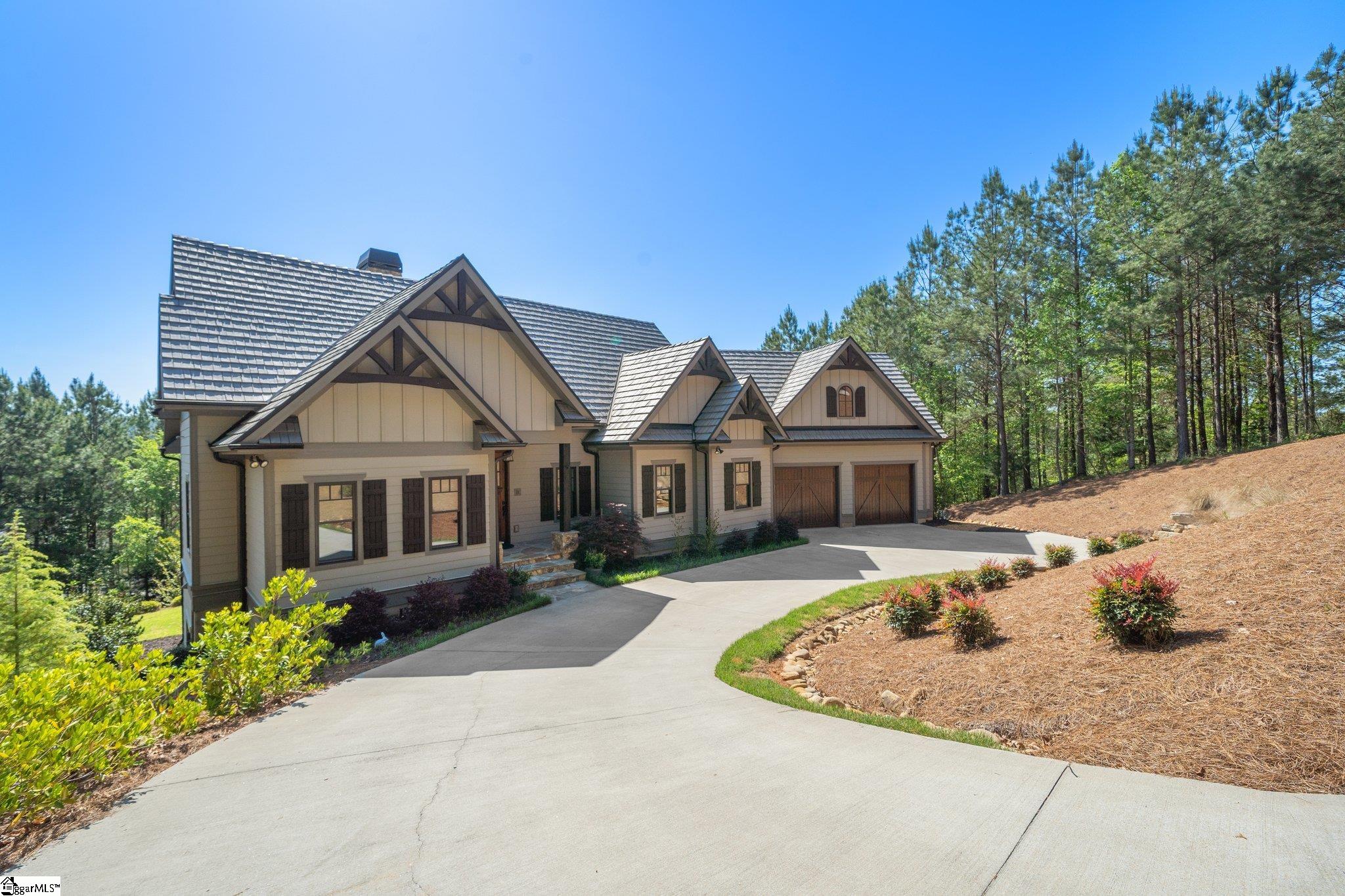 Impeccably maintained and professionally decorated and furnished, this 4 bedroom, 4 1/2 bath custom built home built just 3 years ago by Golden Corner is located near the Reserve Keowee gate with convenient access to Clemson, Pickens and Seneca. The entire first floor is flooded with natural light that shines throughout which makes this home so inviting the minute you walk through the front door. You’ll immediately notice the wall of windows in the great room with the cathedral ceiling, providing direct access to a covered porch for entertaining overflow. Gourmet eat-in kitchen with white cabinetry, granite counters, extra-large kitchen island, Jenn Air appliances, beverage/coffee bar with beverage fridge, built-in Elkay bottle filler and extra-large walk in pantry. The screened porch off the dining area of the kitchen provides another porch to enjoy your morning cup of coffee, afternoon beverage or dinner. The granite island provides additional seating to the dining table that easily seats 8. Hardwood flooring and tile flooring throughout the entire house. Custom window treatments create the perfect finishing touch. The well-appointed master suite has an oversized curbless shower for easy access, double sinks and extra-large walk-in closet. Motorized roller shades in kitchen and screened porch. The terrace walk-out level includes a wet bar with beverage cooler, large family/rec room, guest bedroom ensuite and two additional bedrooms with direct access to two additional full baths. There is an additional bonus room that can be used as a 5th bedroom, media room or office. Access the covered patio through the glass doors off the rec room and walk the stone steps down to the fire pit with seating in the back yard. Seasonal water views. Premier membership deposit of $72,000 is required to be paid at closing. Appointment required.