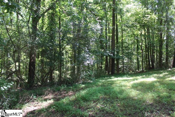 ~New doublewide homes, now allowed, per Seller as of 5/24/23 ~ 1.01 acre lot just outside of Belton City limits with magnolias and mature hardwoods is ready for you to bring your builder and ideas!  Pins have recently been marked to make easier for viewing.  Property is accessed by mostly clear easement road making it very private and begins level and then a very gentle slope before leveling again.  No current known restrictions, but Seller will place deed restrictions of no singlewide mobile homes as closing.  NEW Doublewide homes allowed as of 5/24/23. Modular homes are allowed.  Additional 1.26 acre nearby level mostly clear lot is also available for purchase. Buy both lots and be neighbors with friends or family!  Please schedule appointment, prior to walking on property.  Public water is available on Cherokee Road, but not currently on Sam Drive.  Buyer will need to install well or pay a private contractor to join city water system.