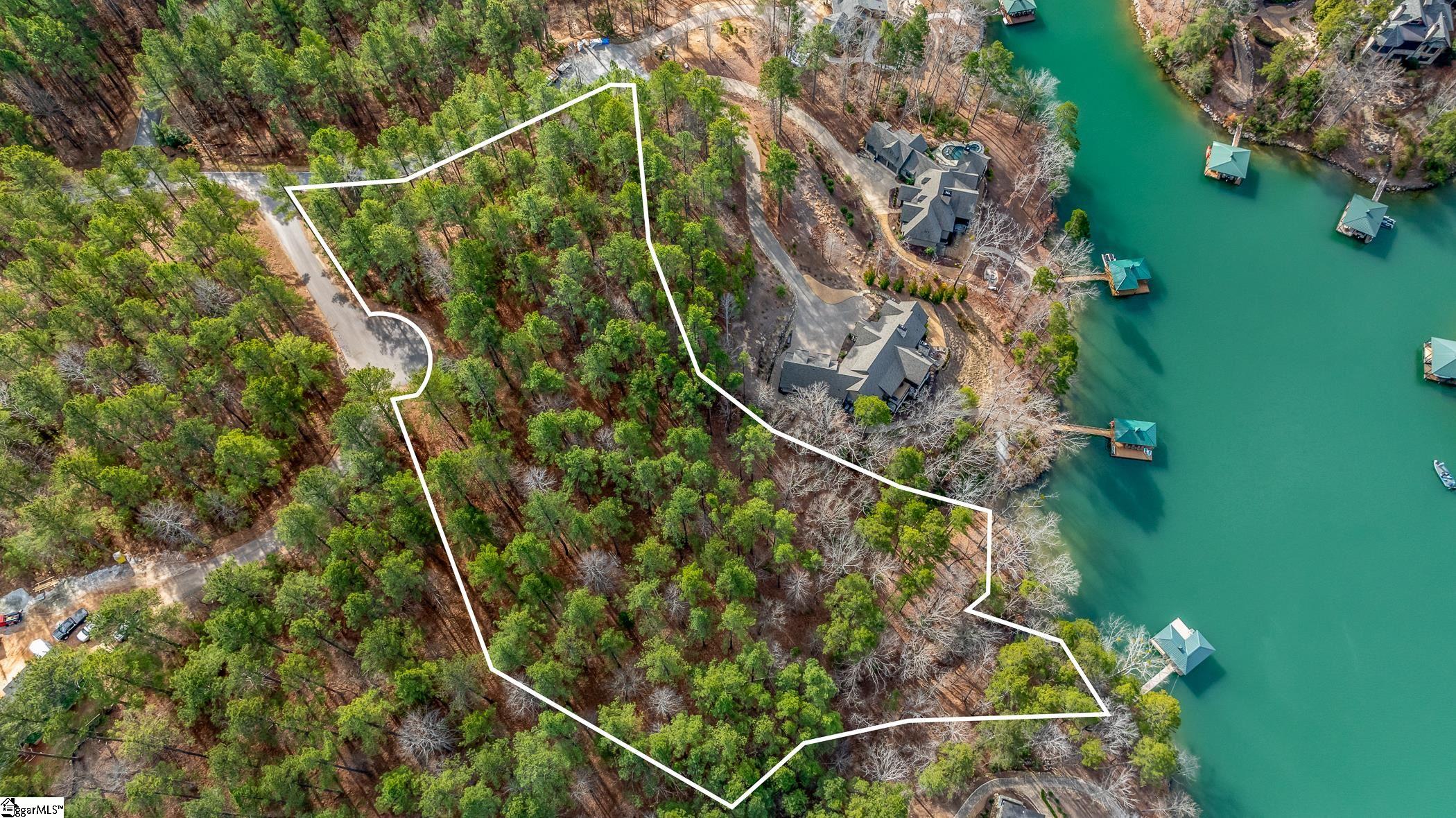 Two are better than one!!! The chance to acquire not one, but two adjacent lots is a rarity. Located at 105 Reflection Ct., these highly desired properties offer a combined 3.62+/- acres on the picturesque Lake Keowee, in the sought-after community of The Cliffs at Keowee Springs.Situated on a tranquil cul-de-sac, both lots provide an ideal setting that will allow you to enjoy the perks of waterfront living, including family activities and water sports in a private cove. These properties feature natural stone shoreline stabilization and approximately 240’+/- of lake frontage. With their versatile terrain, they provide endless possibilities for your lakefront home design and layout, whether you yearn for mountain vistas and lake views or prefer to be right on the tranquil waters of Lake Keowee. Lot 26 spans 2.27 acres and has been dock approved, while Lot 27 encompasses 1.35 acres and includes a covered dock. Utilize both for your custom build or build on one lot and keep the adjacent lot for extended privacy. Or even save it for a future build for a friend or family members. Join this active community that includes amenities such as a new clubhouse, tennis courts, pickleball courts, golf course, beach club and lake club. A right to purchase a Cliffs club membership is available. Membership grants access to amenities across all seven Cliffs communities. These properties offer an outstanding chance for lakeside family-living at its best. Don't miss out on this unique opportunity.