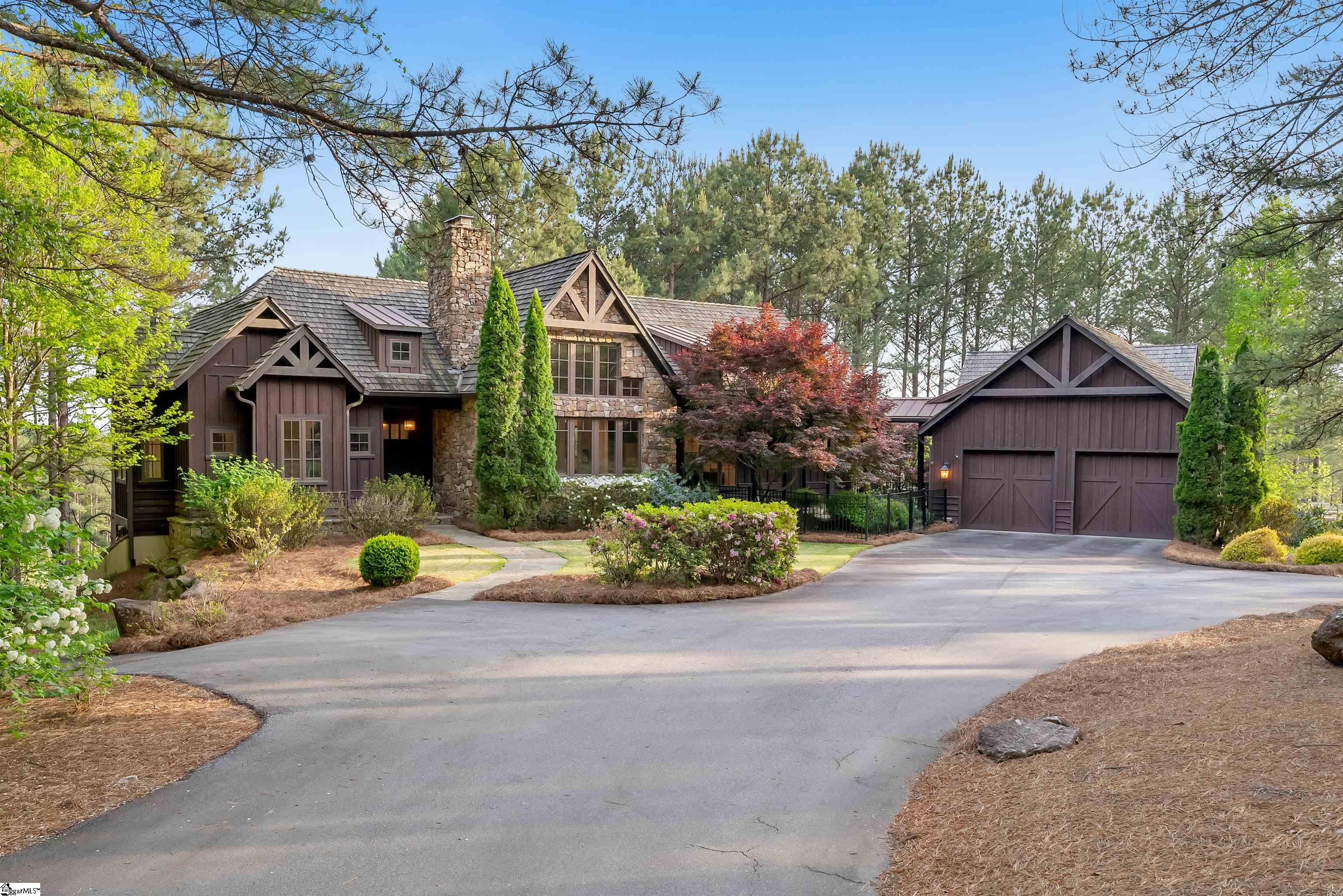 DELIGHTFULLY REIMAGINED & IMPECCABLY FURNISHED! This turn-key home is nestled on a beautiful 2.84-acre lot overlooking the 6th green of The Reserve at Lake Keowee’s Jack Nicklaus signature golf course. In addition to the main house, there is a spacious guest house…a compound that is truly one of a kind. AND it is move in ready and totally furnished! It features over $600K in upgrades - completely remodeled since 2020. 355 Keowee is in an ideal location in The Reserve: not only is it a short golf cart ride to The Reserve’s village, but it's also a quick trip by car out RLK's Keowee gate for easy access to Clemson.  This stunning retreat provides an optimum investment opportunity for family getaways or casual business retreats. This mountain contemporary home provides a comfortable escape for two, and will graciously expand to accommodate gatherings of twenty. There are 6 bedrooms (plus sleeping loft), 5 full/3 half baths, 3 living areas, 3 fireplaces, 5 porches. All living/entertainment rooms have fabulous views of the golf course and the surrounding hills. There are multiple master suites, two kitchens, plus numerous indoor and outdoor living areas. A spectacular game room with bar is perfect for a variety of festive gatherings, whether it’s game night, college football watch party, or Sunday at the Masters! Or just turn on your playlist music with the entertainment system – now that’s a party!  Here are a few additions that could seal the deal: Wolf professional range in main kitchen, main house porch with retractable screens, bunkroom that sleeps 6, a whole house generator (main house), golf cart and storage room, Redline garage storage cabinet system, a large fenced dog yard, two Control 4 entertainment systems, multiple large-screen televisions, an AOG gas grill and a Traeger smoker.   Are you hoping to enjoy a Lake Keowee area home ASAP? Or perhaps a lot owner with sticker shock with quotes for a custom-built home? OR looking at homes that need renovation to suit your needs? Rest assured that this home is ready for you, your family & guests for summer 2024!   All RLK homes are eligible for the club rental program; this home would be perfect. Call listing agent for details. RLK Premier membership is required. $72,000 membership fee is not included; Buyer to pay at closing.