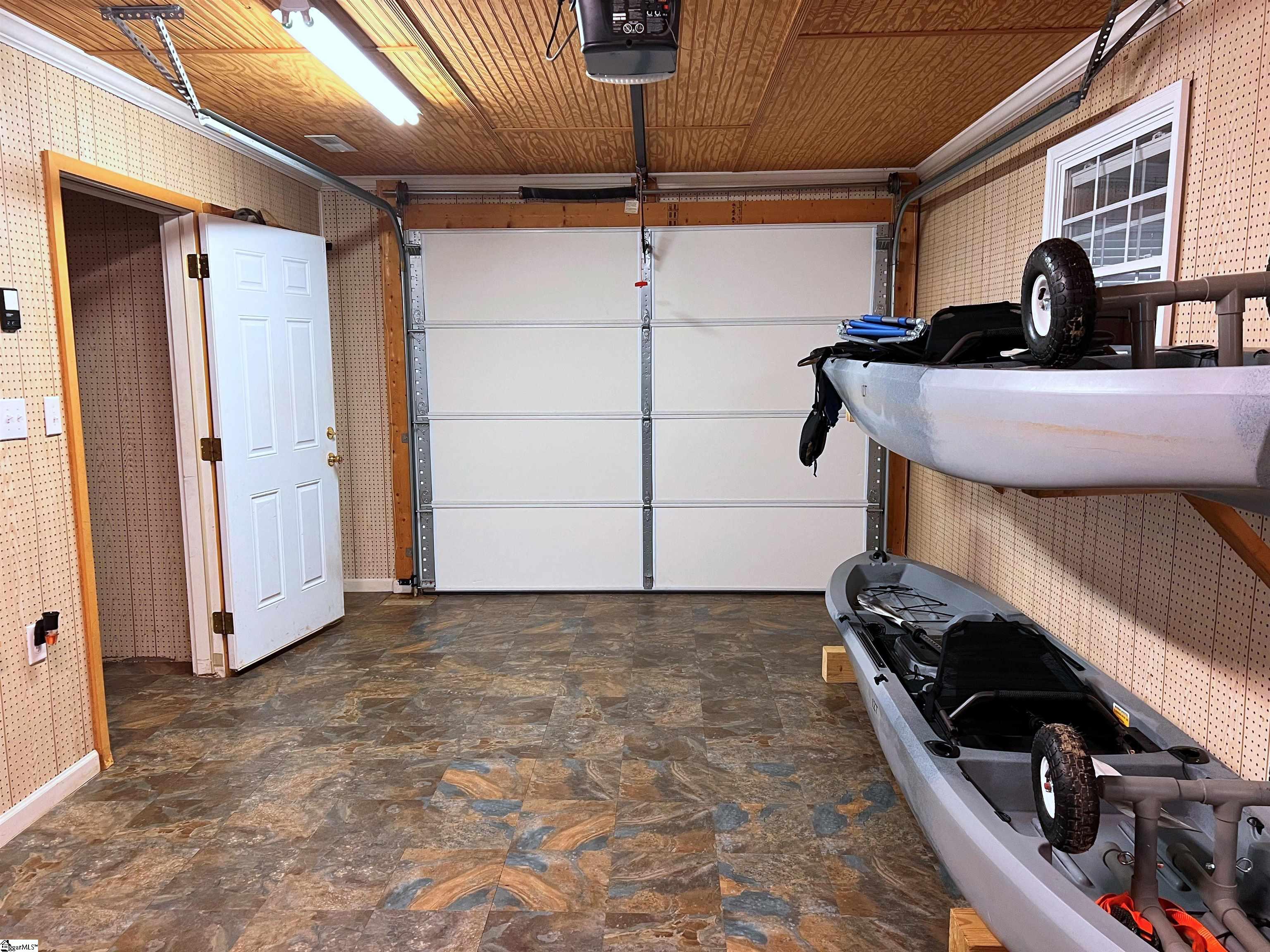 HAS 2 OPPOSITE AUTO-GARAGE DOORS