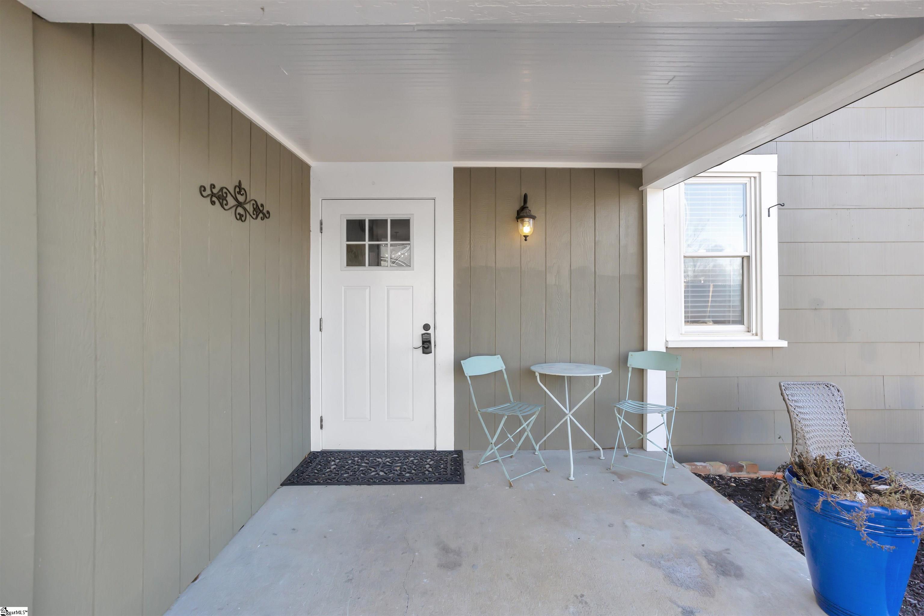 Main house has a concrete back patio.