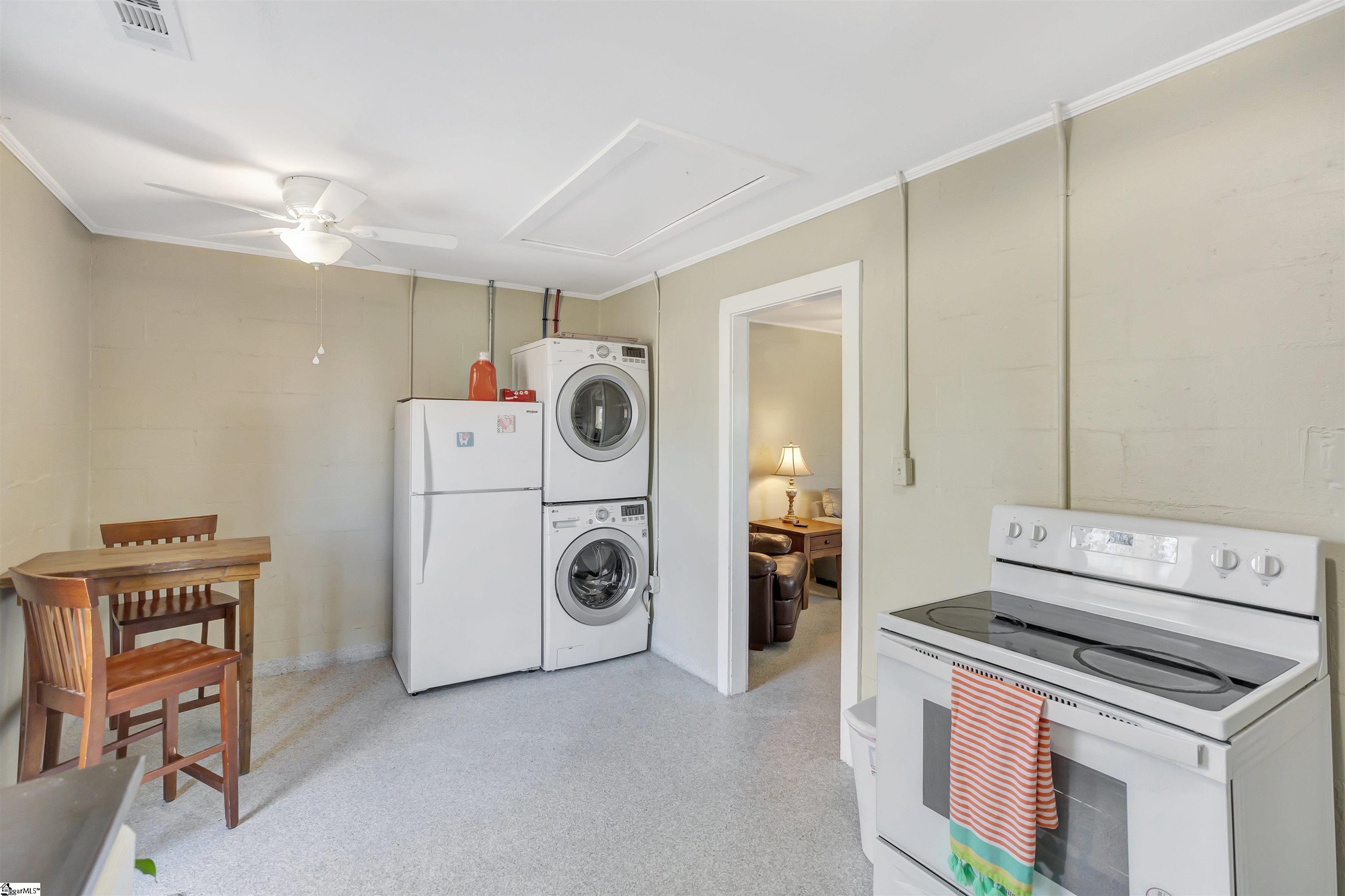The guest house laundry is set just to the side of the kitchen area.