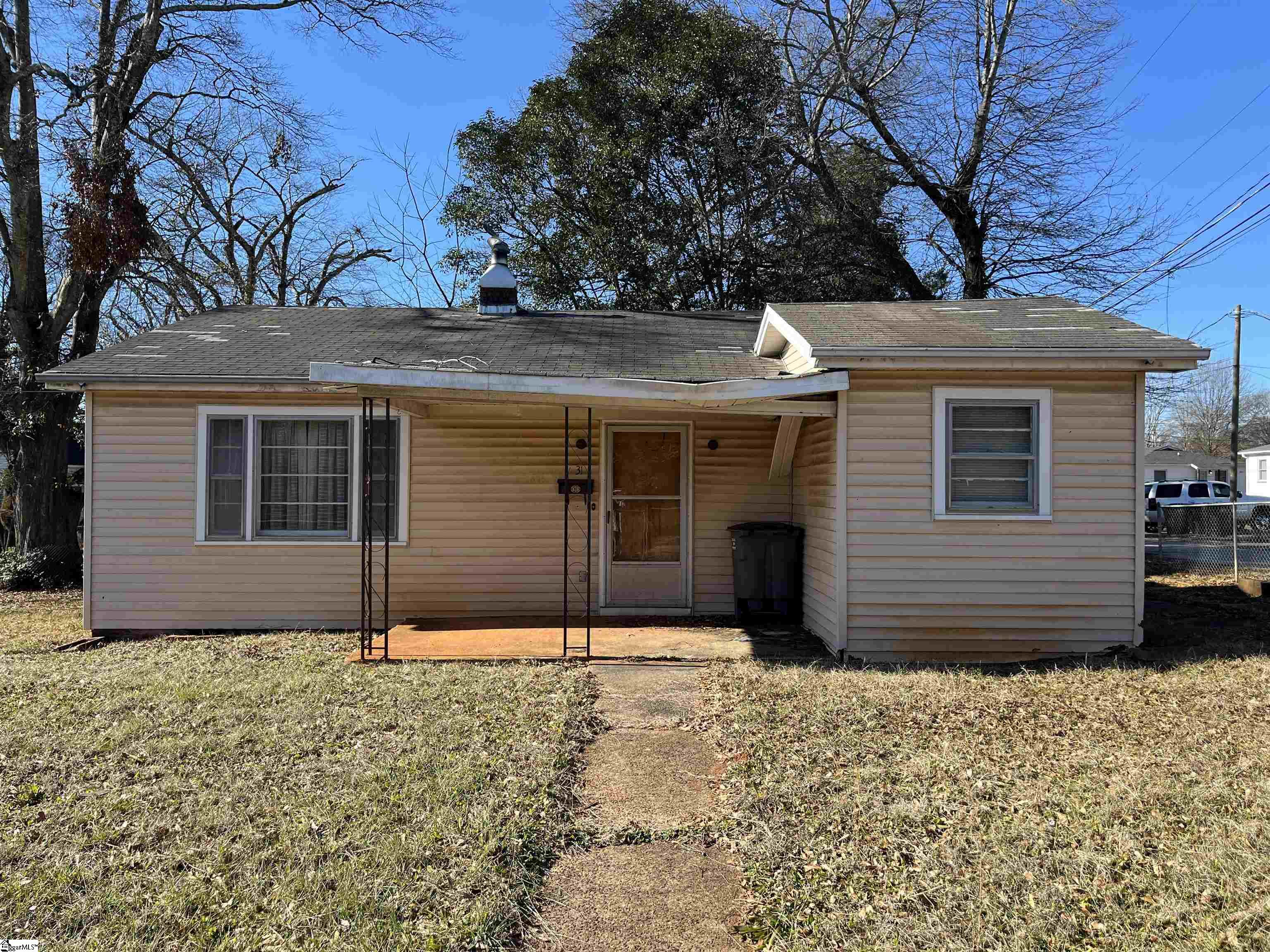Location, location, location!  This home was well loved by one family for many years, and is being sold as an investor special, AS IS, due to repairs needed.  Will not qualify for traditional financing.  Roof has an active leak and ceiling has fallen in, in the kitchen.  Located near the Swamp Rabbit Trail,  only five minutes from downtown Greenville and just around the corner from Greenville Textile Heritage Park.  Home is outside of the city limits.  Great opportunity in a great location! Home is shown by appointment only.