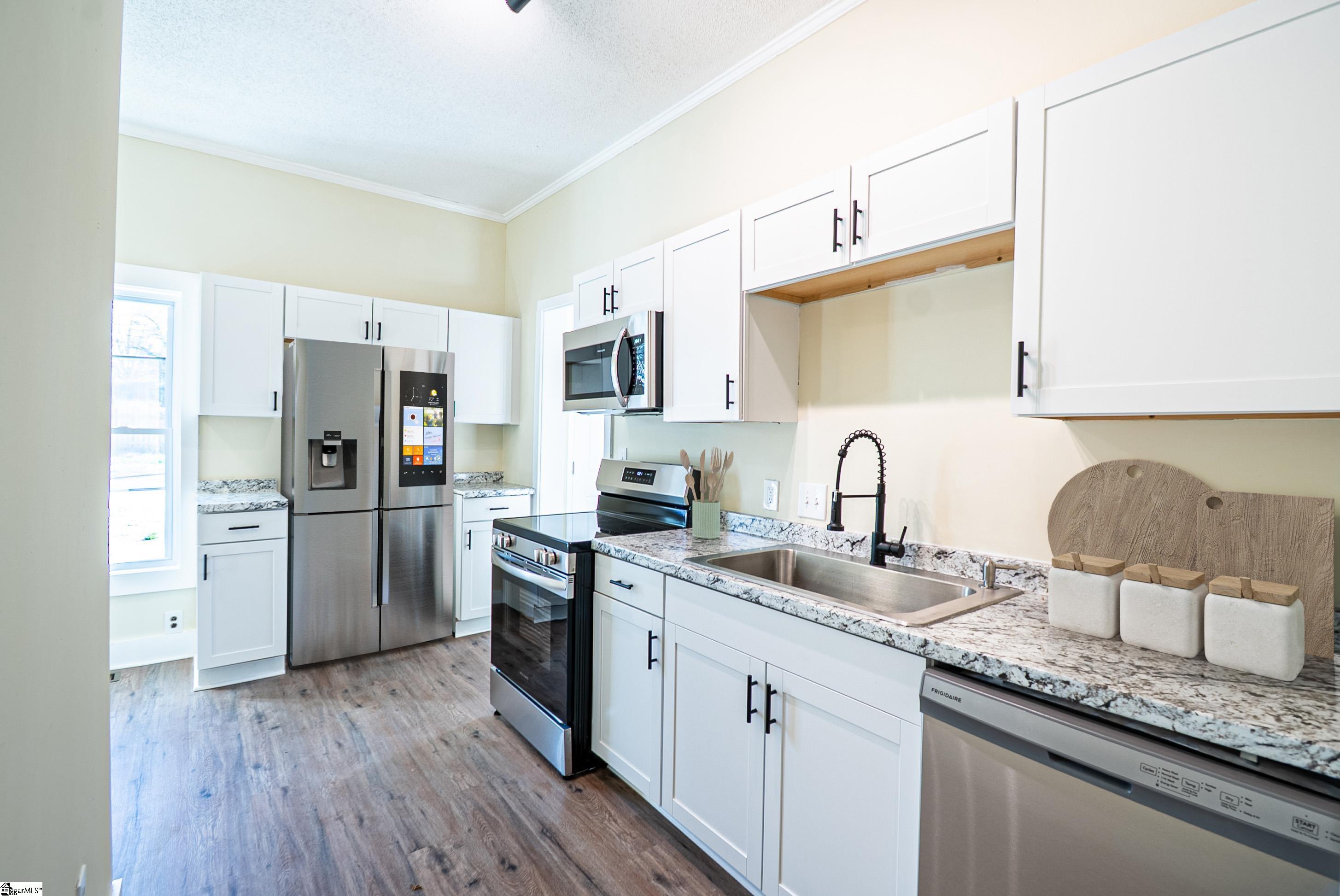 Kitchen has been virtually staged. Refrigerator is not included.