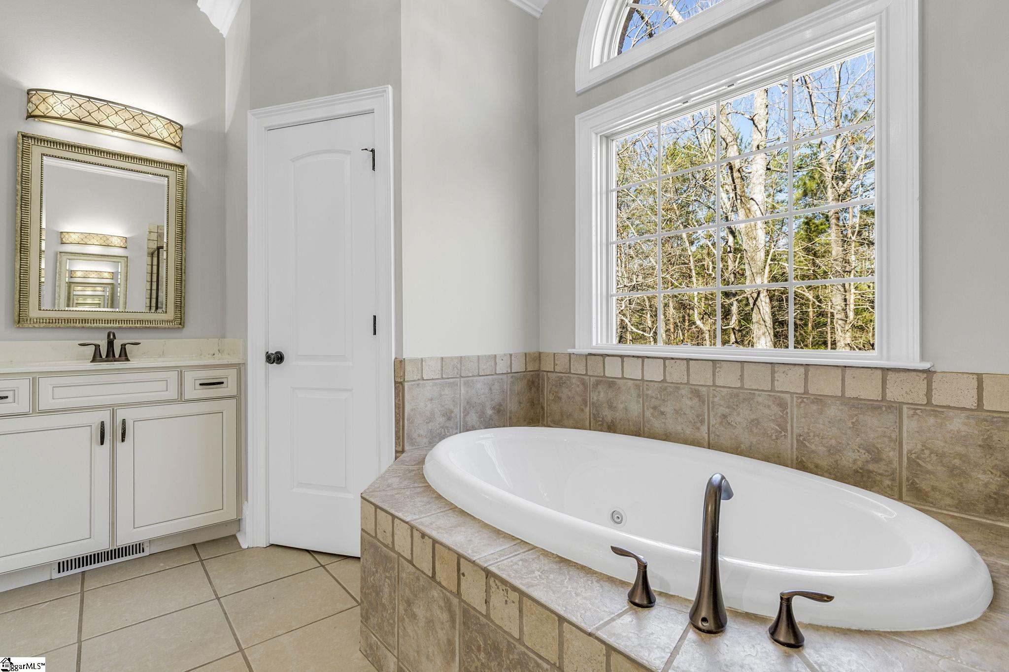 En Suite Master Bath...Featuring Dual Closets and Vanities