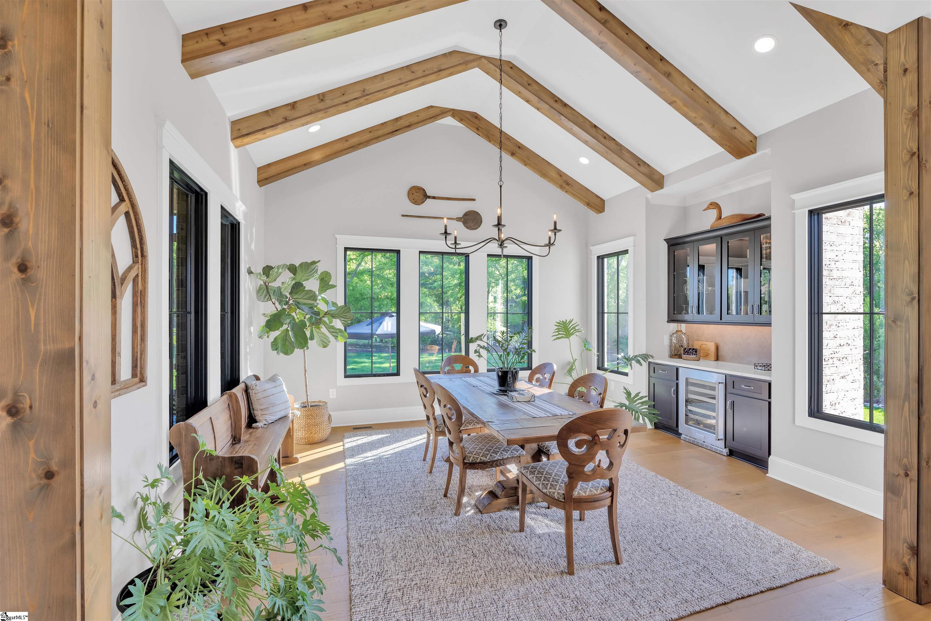 14 foot vaulted ceiling with custom wood beams and dry bar with a wine chiller.