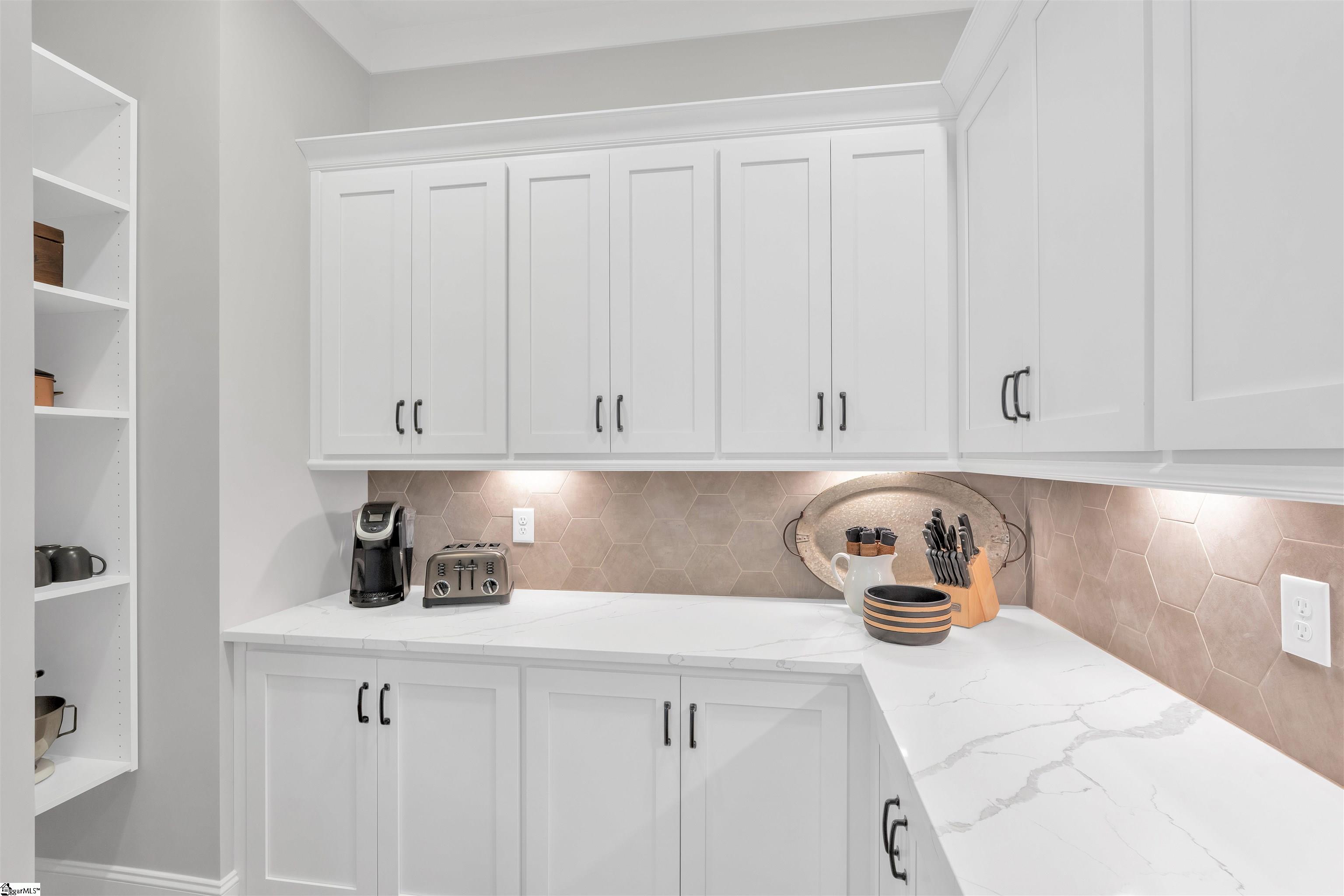 Walk-in pantry just off the kitchen with tons of storage and extra countertop space.