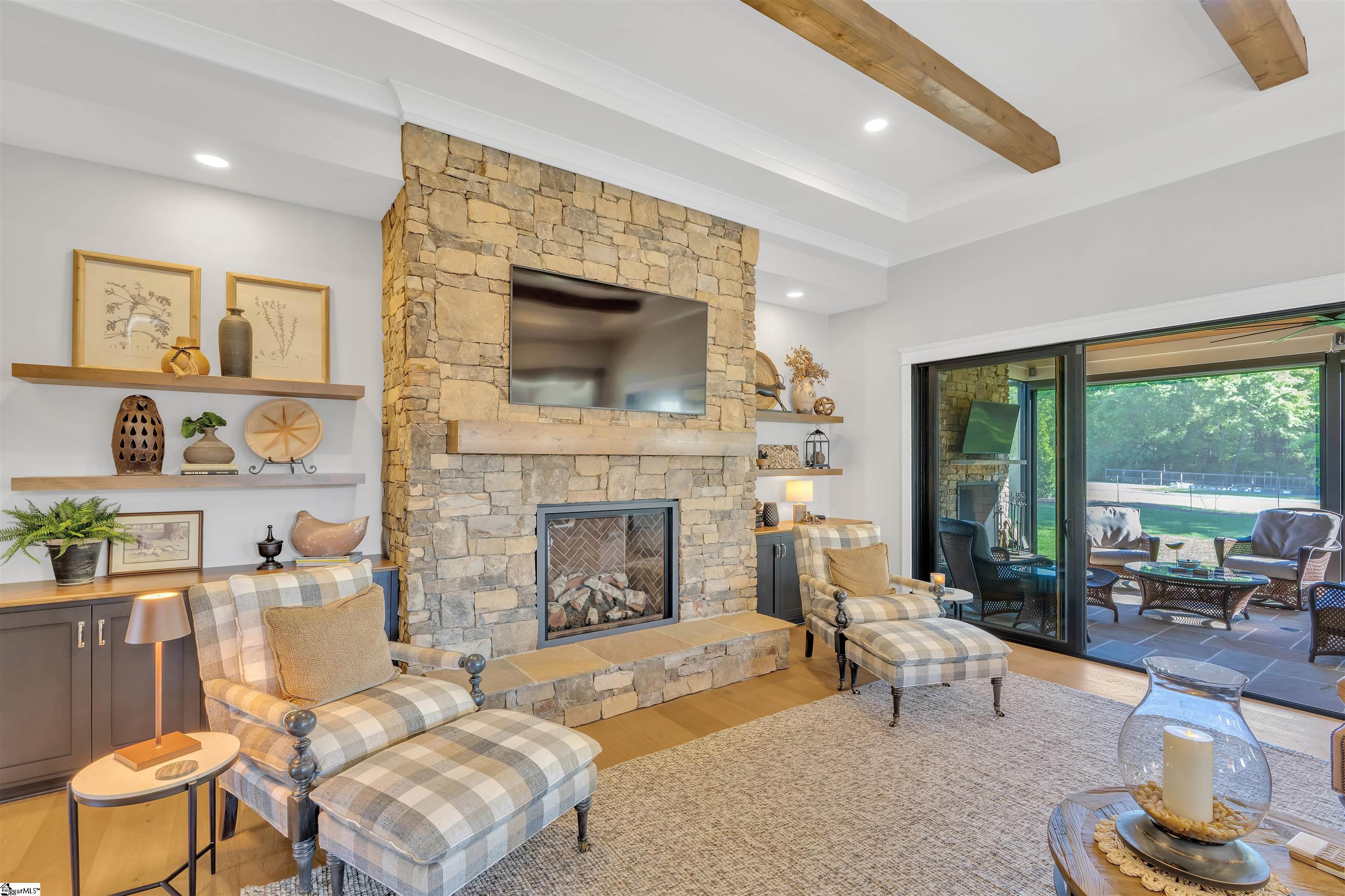 Capacity to heat entire home.  Stone facade and Wooden Mantle, flanked by custom built-ins
