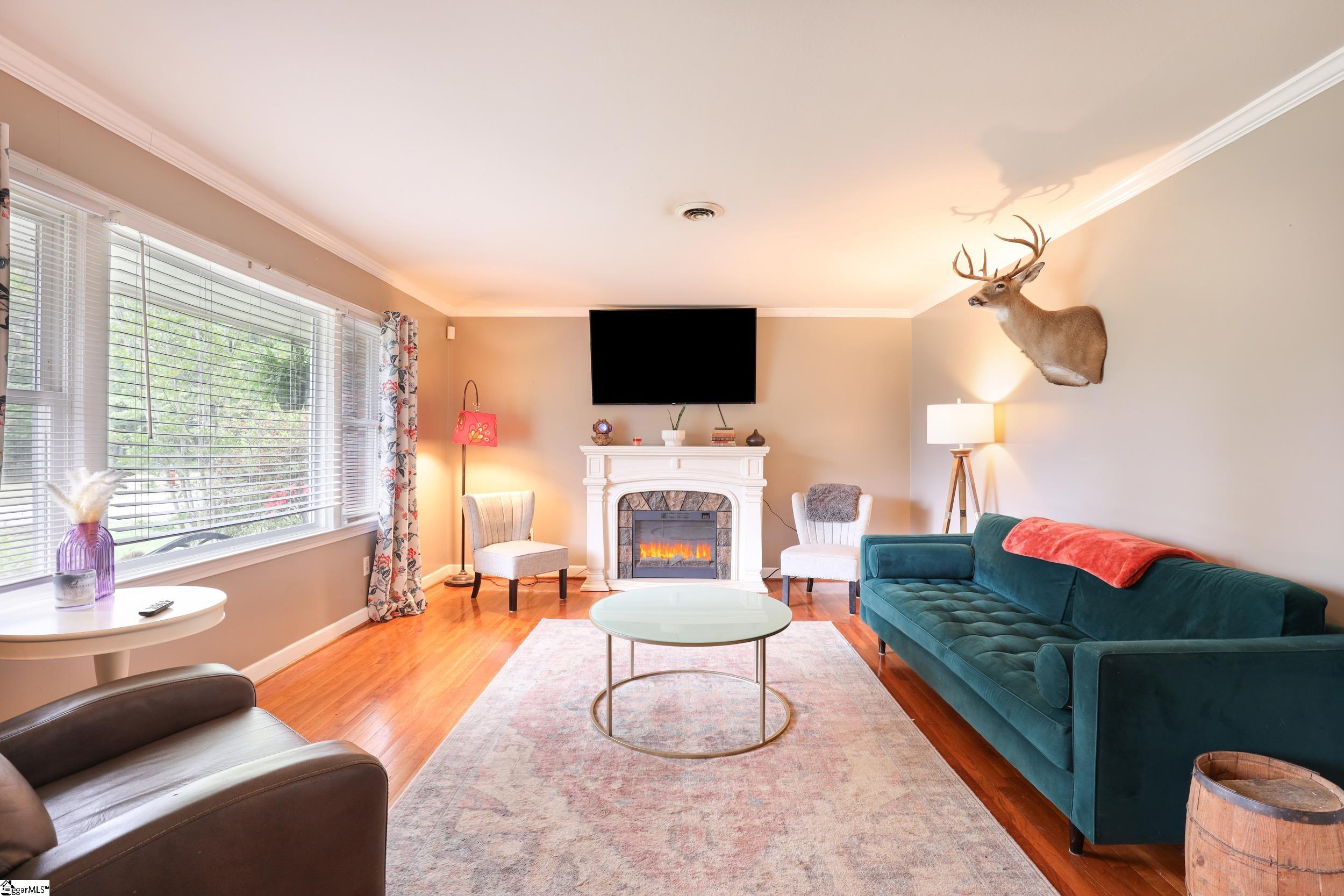 Main floor living room with beautiful hardwood floors.