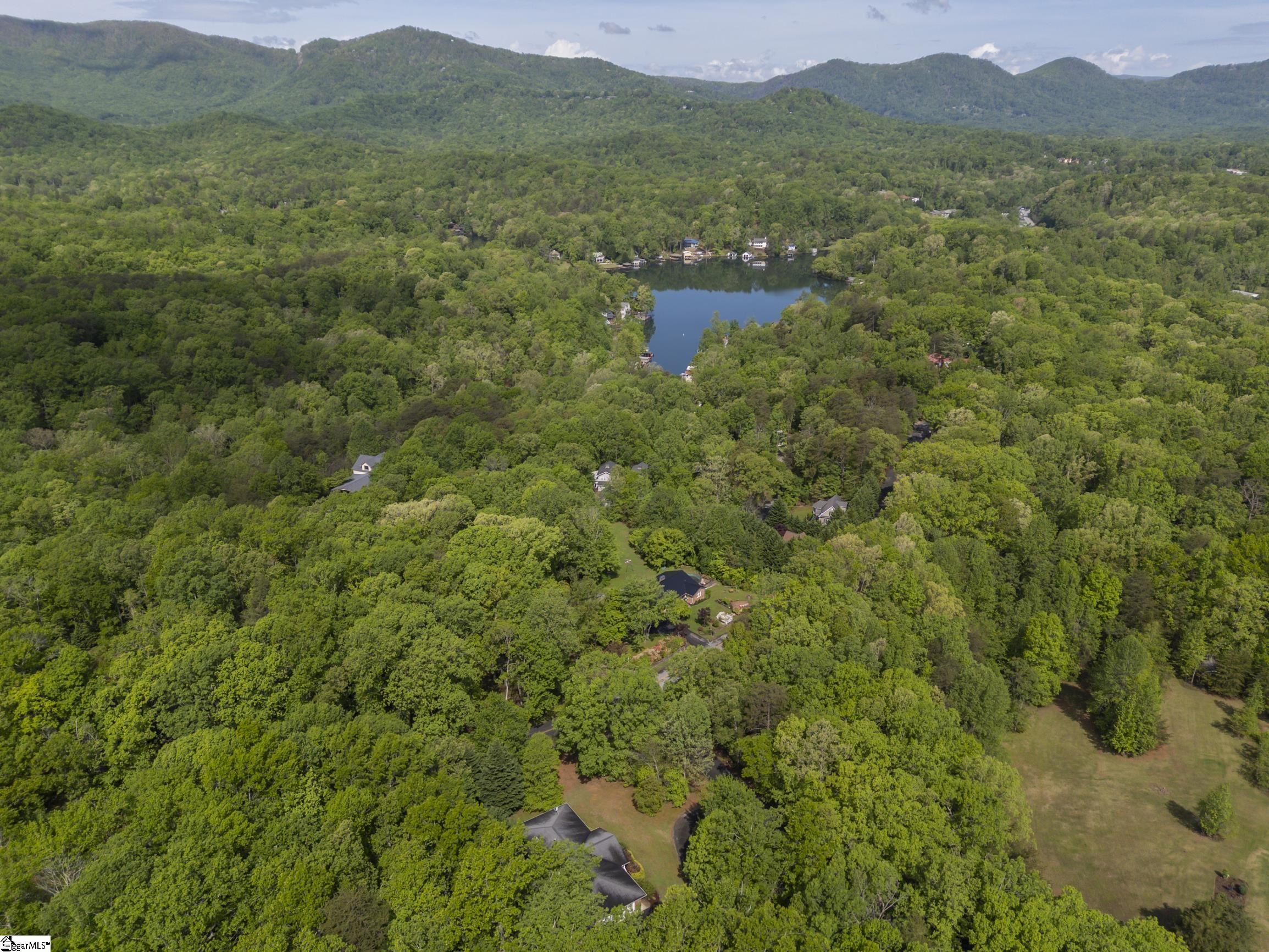 This shows the distance of the Lake and mountains from a shot above the property.  Winter views of the mountains are seen directly from the home.