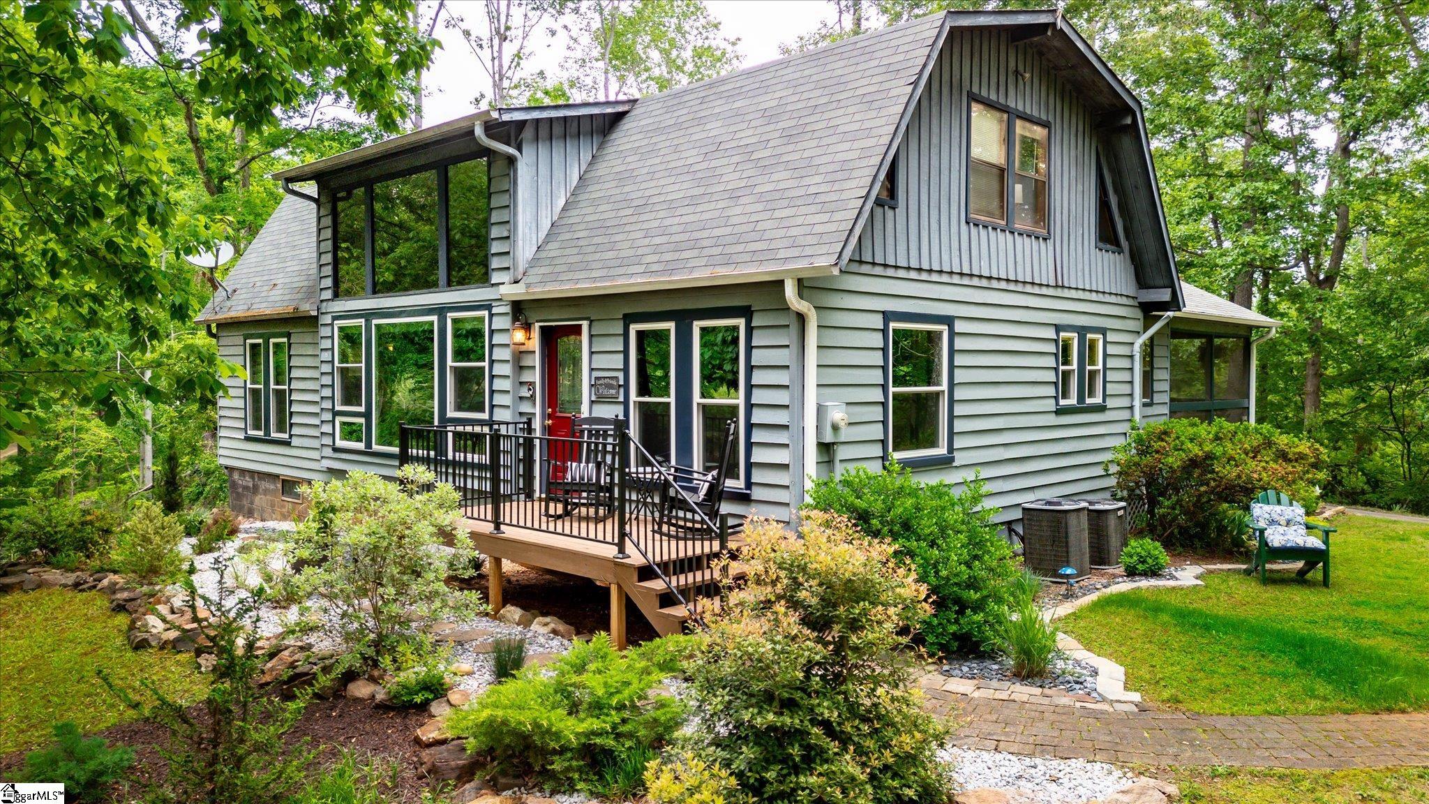 Welcome to this stunning four bedroom, three bathroom home located in the charming town of Seneca, but only short drive to Clemson University. Situated near picturesque Lake Hartwell, and the Friendship Boat Ramp for easy lake access, this 1.13 acre property boasts a serene setting surrounded by mature trees and beautiful landscaping. Step inside to be greeted by a spacious living room with soaring ceilings, providing an airy and bright atmosphere. In the kitchen you will find tons of cabinets, perfect for all your storage needs as well as ample counter space for easy meal prep. The sunny dining room is open to kitchen, making a great entertaining area.  The wood walls scattered throughout the house add character and warmth to several rooms.  The screened porch with attached deck offers the perfect spot to relax and enjoy your morning coffee or entertain guests while taking in the tranquil views of the backyard or the winter lake view. The walkout basement, with garage, provides additional storage space and endless possibilities for customization.  The circular driveway not only adds curb appeal but also provides ample space for parking and additionally there’s a carport for covered parking too!  Whether you're looking for a quiet retreat or a place to host gatherings, this home has it all.  Don't miss out on this one-of-a-kind property that is full of charm!  Schedule a showing today and experience all that this Seneca gem has to give.