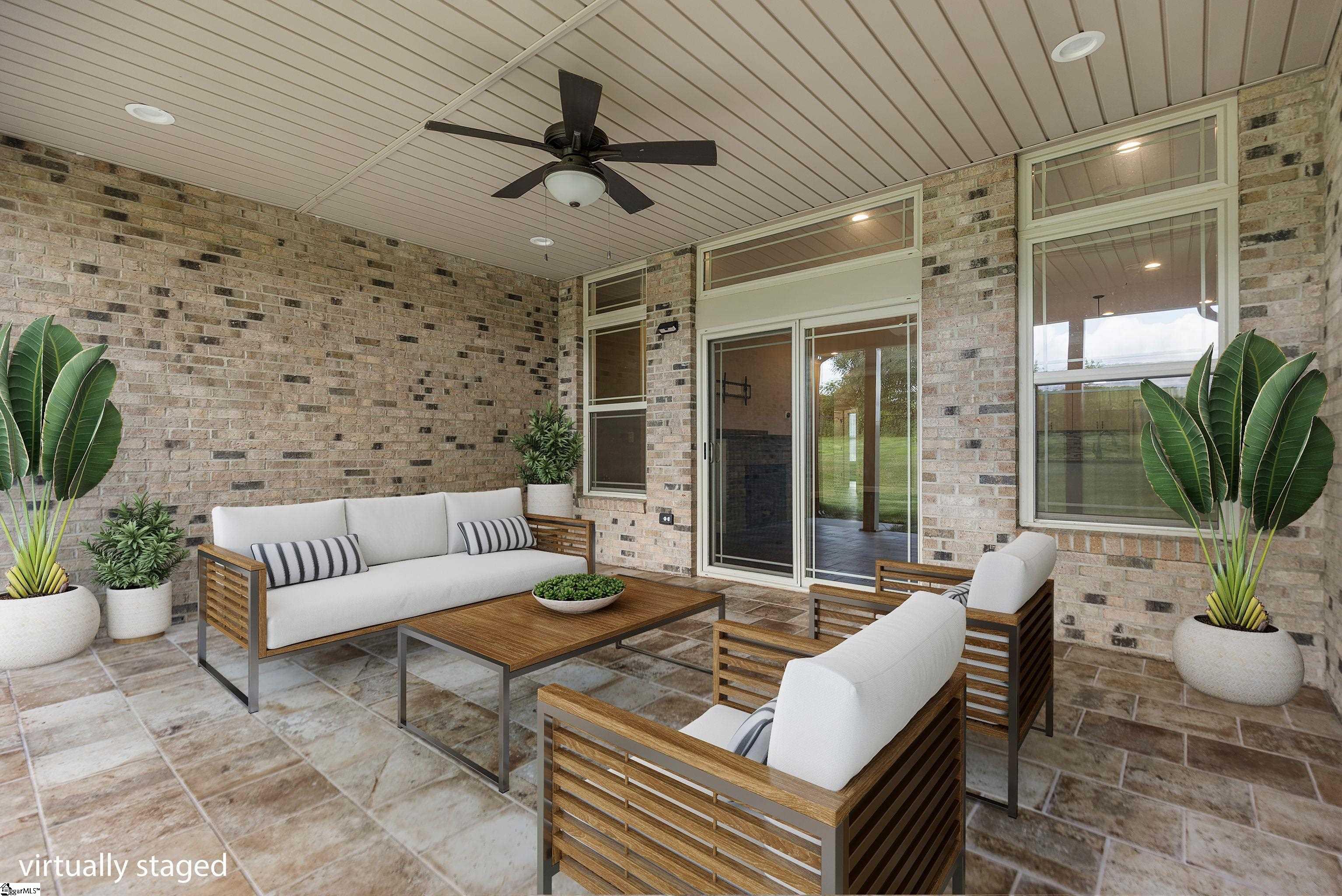 Spacious covered patio designed for outdoor entertaining and year-round relaxation.