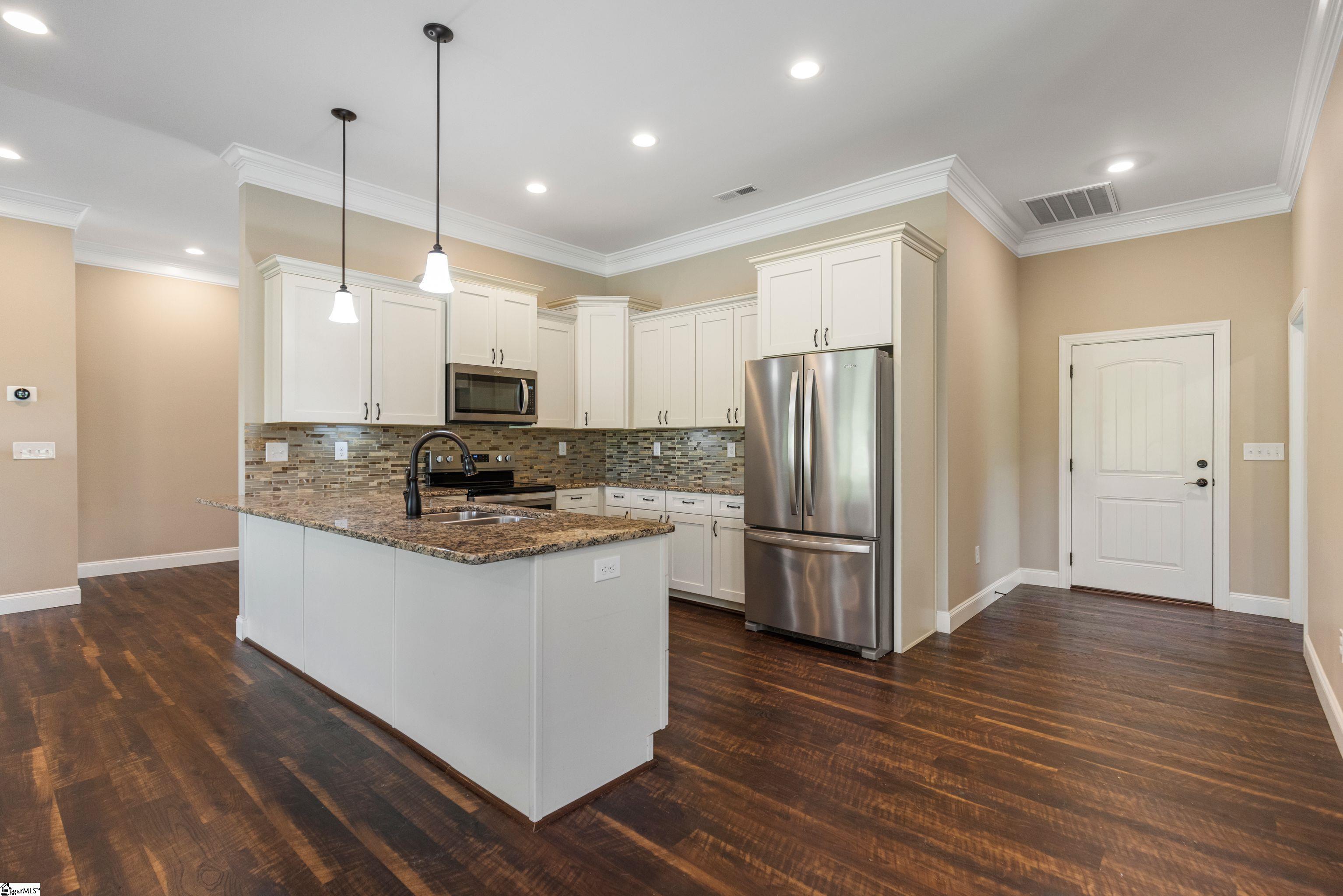 Kitchen featuring a convenient breakfast bar with space for bar stools—perfect for casual dining and entertaining.