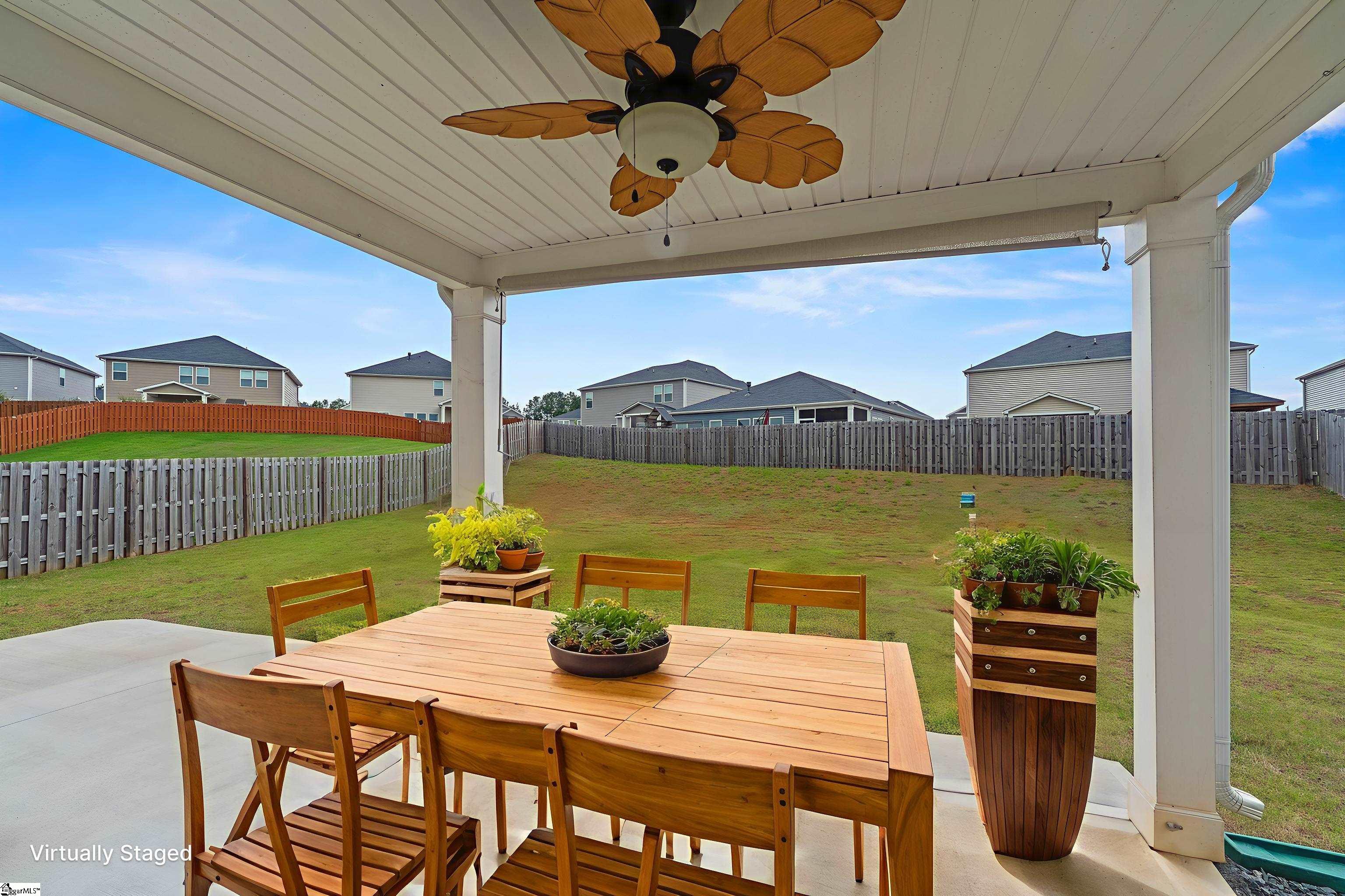 Covered back porch w/extra large concrete deck.