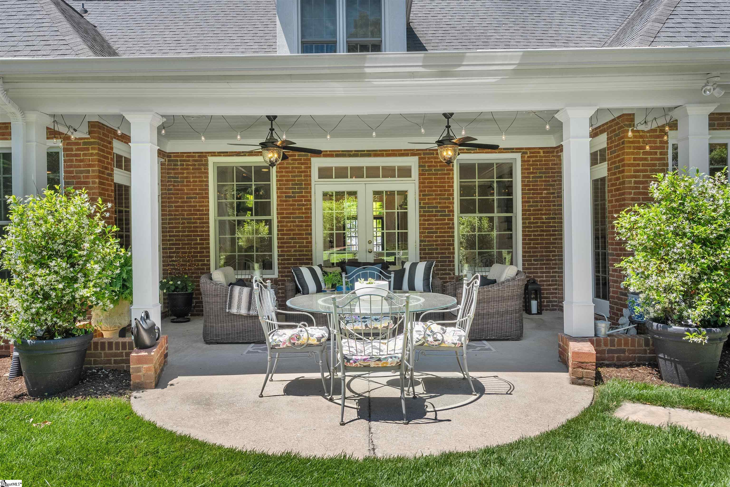 Easy access from home to outdoor living space featuring a covered porch and patio.