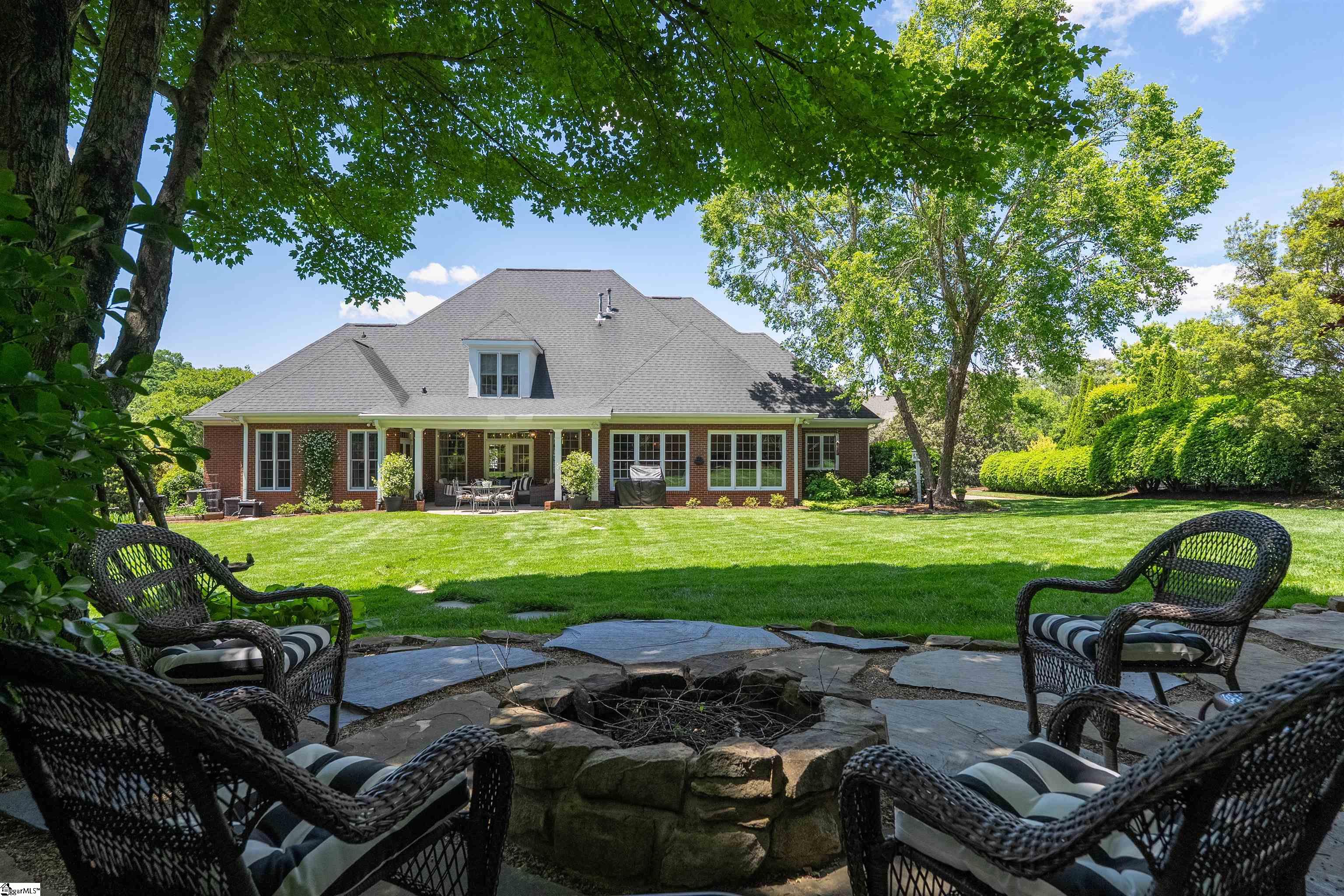 Wood burning firepit with adjacent fountain provide a cozy retreat to enjoy the evenings.