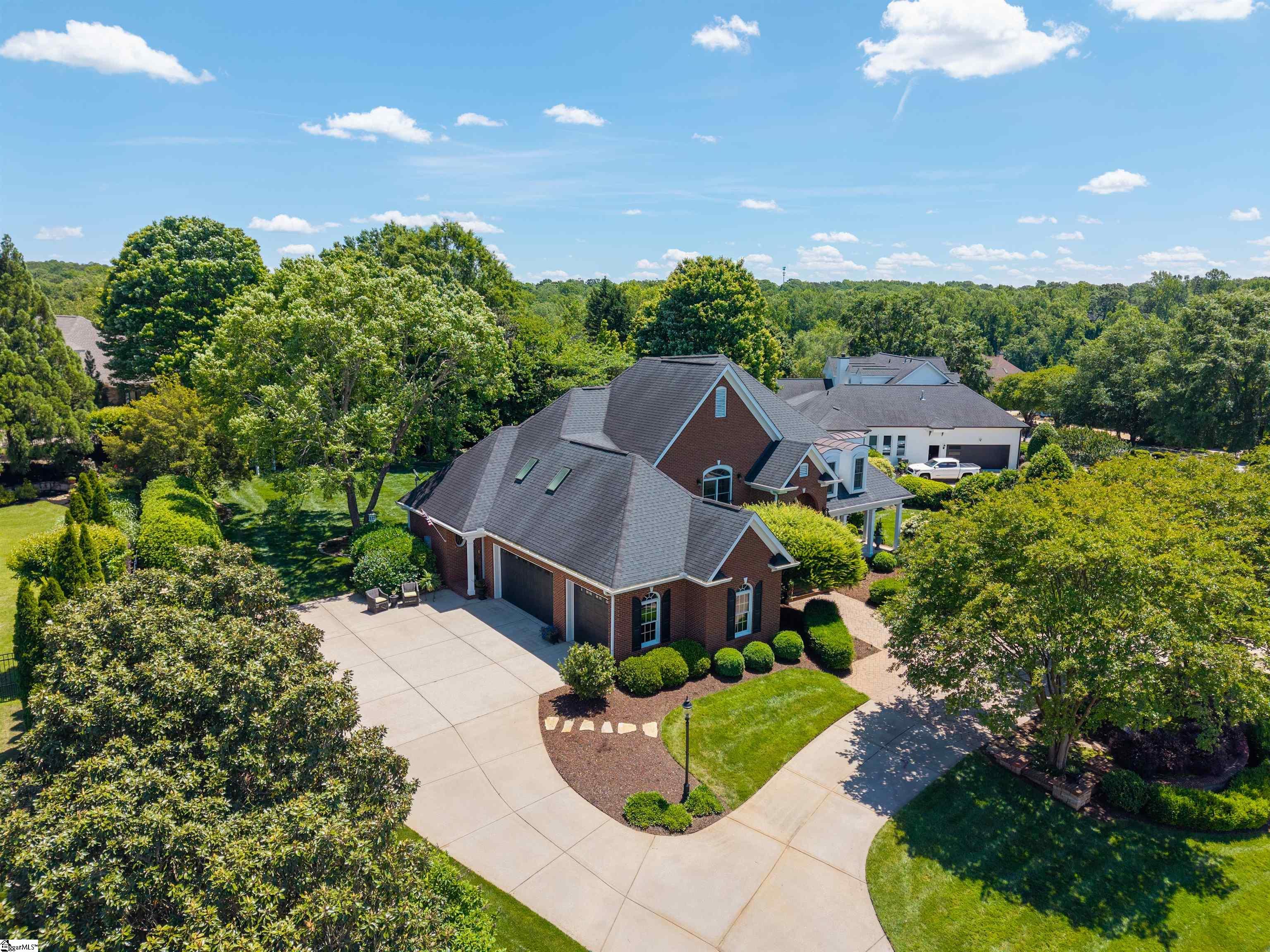 Circular Driveway with extra parking pad.