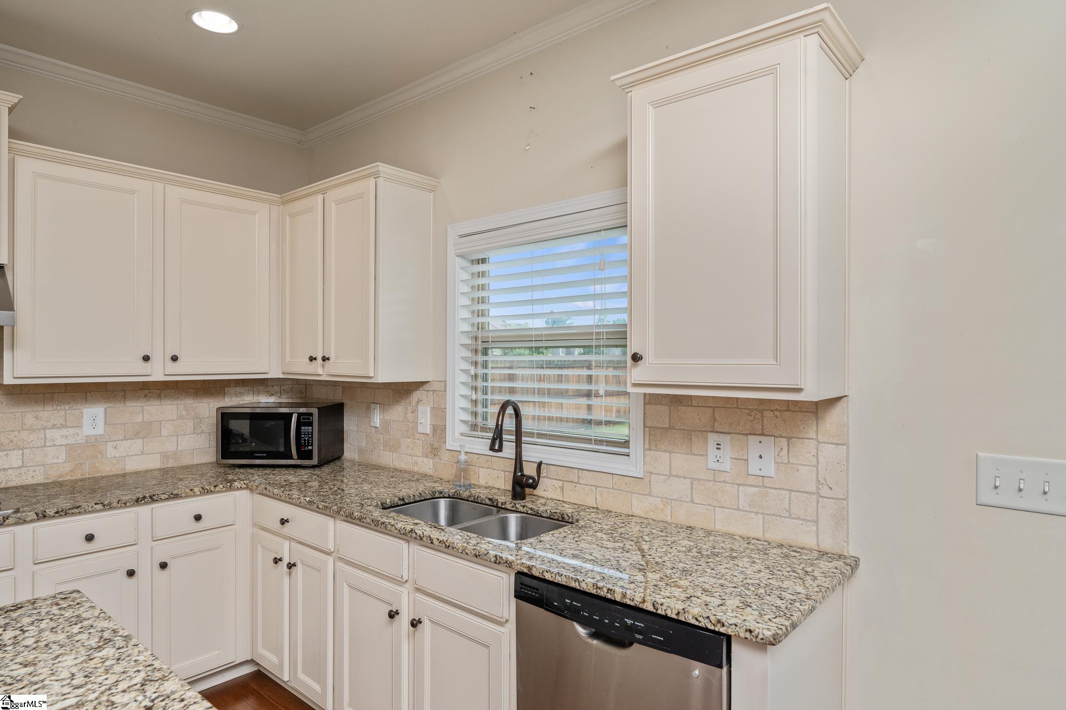Kitchen window overlooking backyard