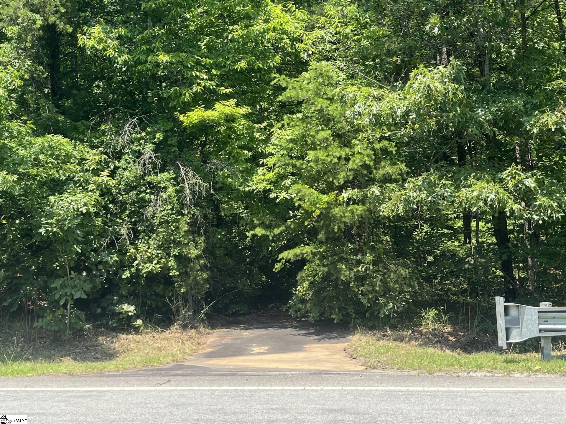 Second entrance to property with apron and culvert off of Hwy 11.  There is no drive into the property from here, but could potentially be used for future additions or splitting the property.