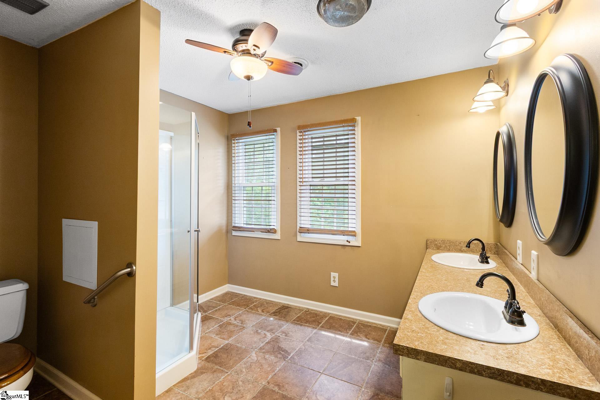 With Walk-in shower and double vanity