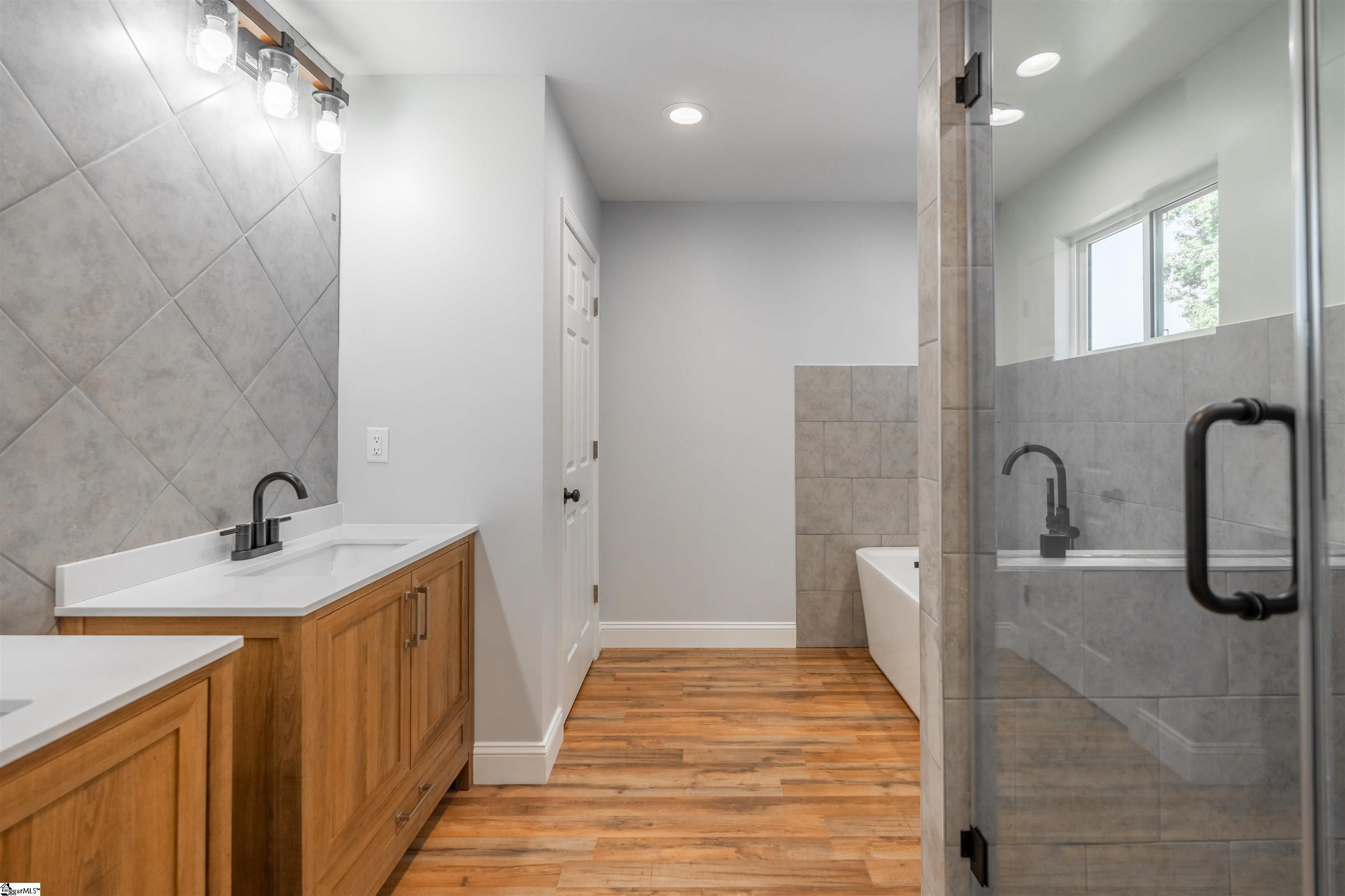 Primary bedroom bathroom suite.