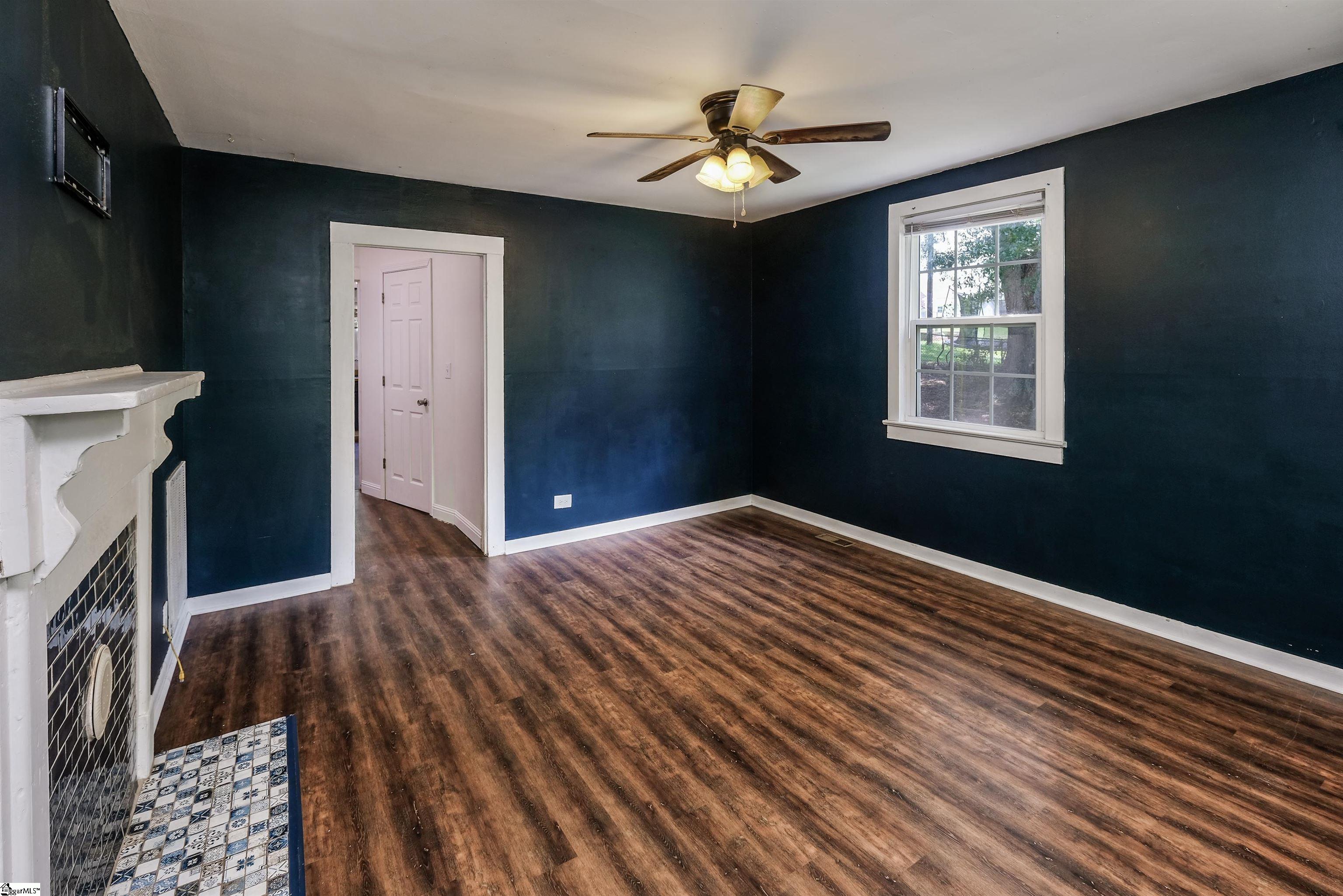 Luxury Laminate plank flooring, ceiling fan.