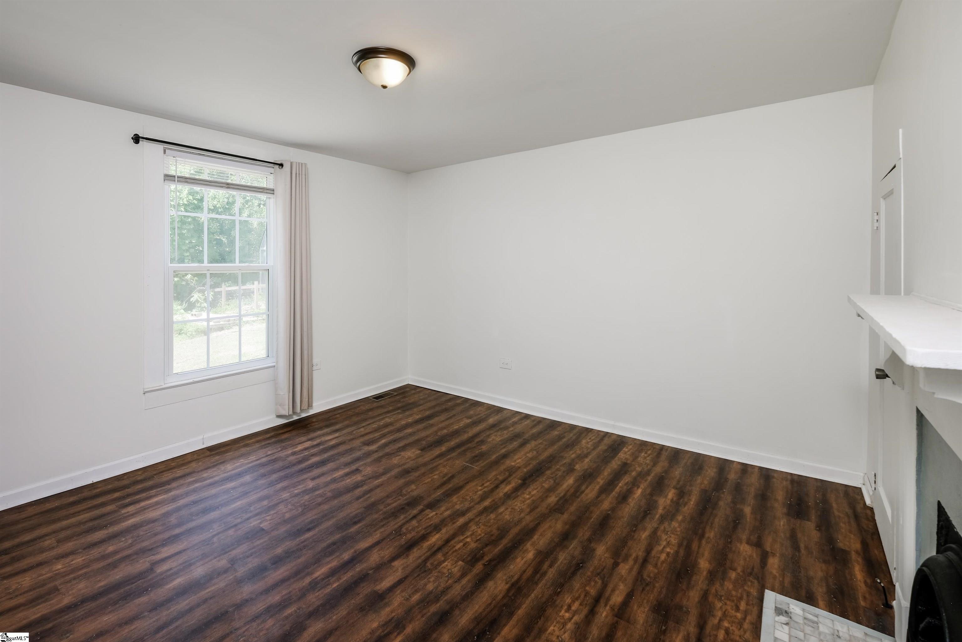 Luxury laminate plank flooring and 3 closets.
