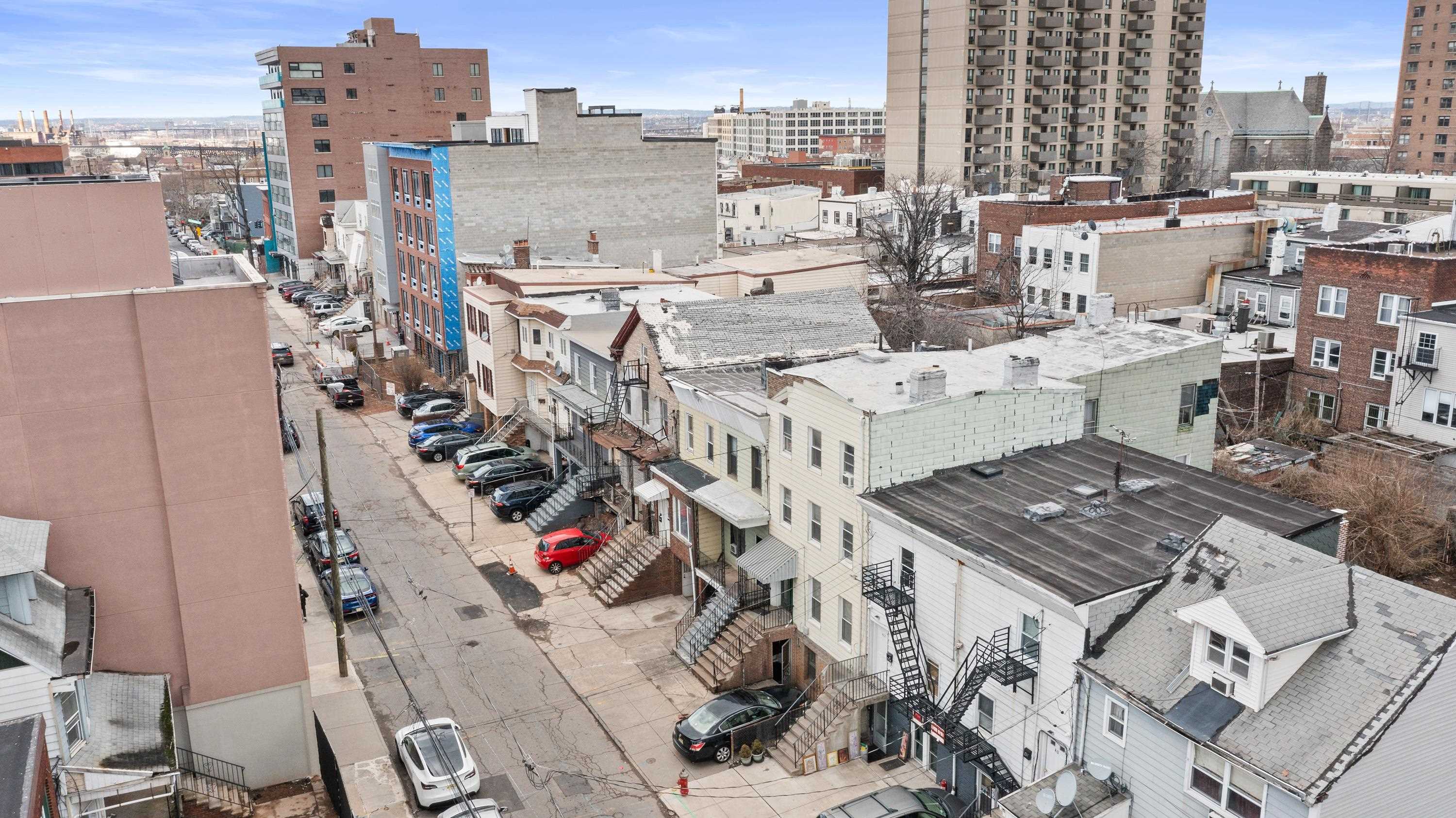EXP Realty has been exclusively retained by Ownership to offer for sale their fee simple interest in 42, 44, 44A and 46 Cottage Street properties, an assemblage that took 7 years to combine, consisting of 9,052 square feet of land, in the 2060 Redevelopment Zone 4 of Journal Square, the highest redeveloping area of Jersey City, Hudson County, New Jersey, which is also strategically located in an Opportunity Zone.  The land currently hosts one to two family housing, three of the four properties are currently rented and will be delivered vacant at closing. The houses do not posses any historic significance and can be fully demolished to build new contemporary building. As per the site analysis study conducted by Anthony C. Vandermark, the Principal Architect at MVMK Architecture & Design, the site is zoned for 6 stories / 64’ – 00”, As of Right Residential Project, 46,125 SQFT Constructible and 38,438 SQFT Sellable / Rentable. 50-54 Units with Studios. Site Area qualifies for Zone 4 Office Bonus of 2 Additional floor. No parking being provided which is permitted. *Optional 9th floor could be approved at 101’-08” in height with 10% affordable provided. 9 Story Structure will be classified as a High-rise with Related Code Requirements.”  Site is currently surrounded by tons of Restaurants, Café, Supermarkets, Banks, Hospitals and Corporate Offices. Its conveniently located steps from Homestead Place, a new walkway extension of Homestead Place which has lead to 7, 20 – 27 story high-rise buildings with an influx of over 2000 new construction units.  The gentrifying neighborhood is evident by the new construction residential and mixed use projects surrounding the site. The upcoming Homestead Place Pedestrian Plaza will house many new cafe, restaurants, office and retail spaces surrounding the area, a street referred most commonly as being similar to Stone Street in Manhattan’s Financial District. A quick 5-minute walk from the site provides access to the Journal Square Path Train, # 1 transportation hub in Jersey City, and arrive New York City within sixteen minutes via the Path train.   In addition, the site provides quick access to Newark Airport, JFK Airport and LaGuardia Airport via major roadways such as Route 1, Route 9, and I-78.  Two One Two, Eight Four Four, Nine Three Nine Three, for all questions or appointments.