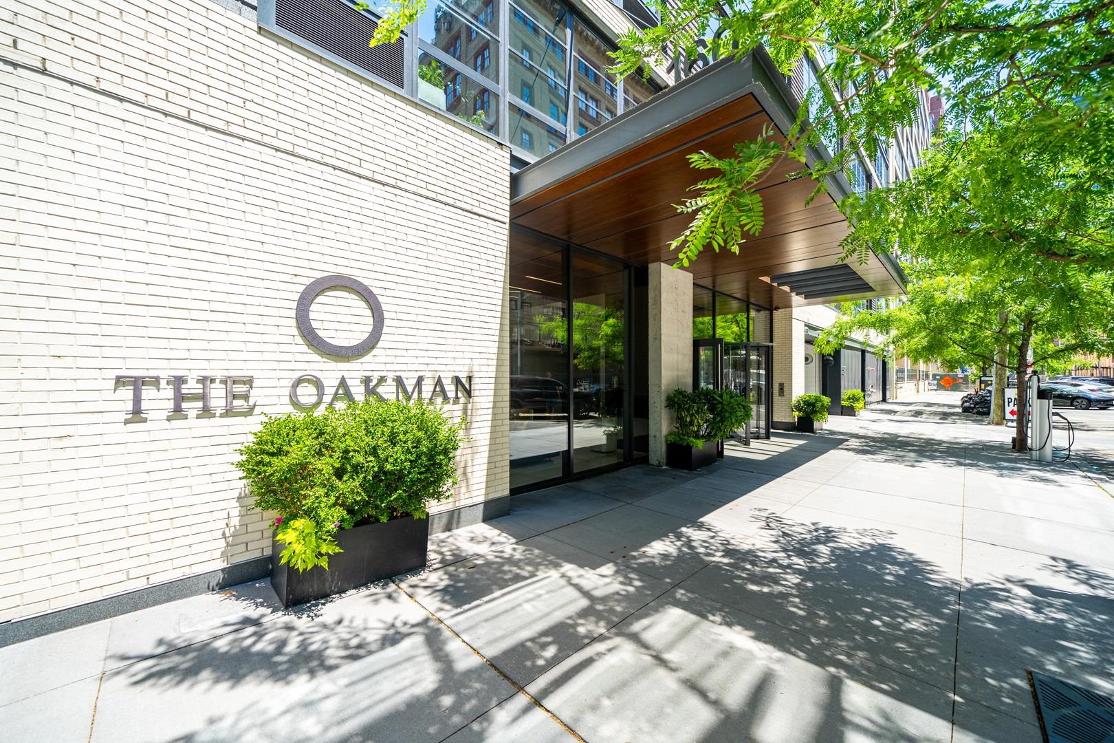 1 bedroom facing North with private outdoor space located in one of Jersey City's most sought after buildings, The Oakman. This unit features white oak hardwood floors throughout, in-unit Bosch washer/dryer. Chef's kitchen includes SS appliances, Fisher&Paykel fridge, Italian Pedini cabinets, quartz countertop peninsula. The Oakman is a full service luxury building with 24-hour doorman, fitness center, children's playroom, rooftop lounge, outdoor swimming pool, BBQ grills, DVORA in home services, dry cleaning! EV chargers and Valet Parking on-site by 3rd party. Excellent location just 3 blocks from the Grove St PATH and surrounded by great dining, shopping & farmers market. 20 year Tax Abatement with 13 years left. This is a Sponsor Unit