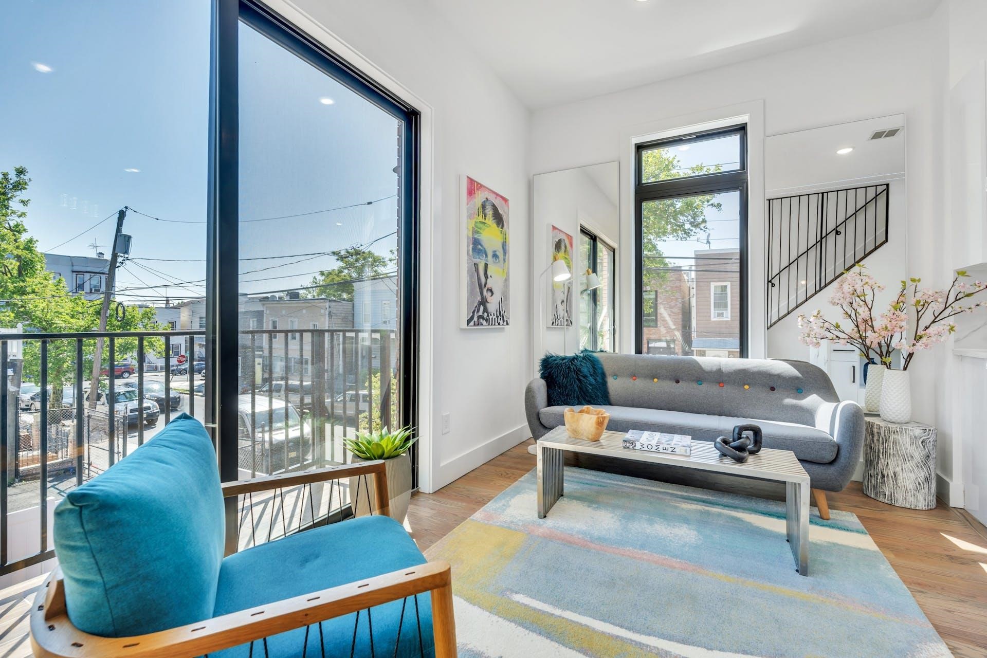 Brand New Unique Triplex Condo Townhouse, located in the heart of the highly desirable Jersey City Heights! Featuring 3 bedrooms, 3.5 baths, corner unit with an abundance of large windows drenched in natural sun light. Main living area with custom design metal railing, high ceilings with LED strip lighting make for a luxurious modern feel, sliding glass doors leading to balcony, contemporary fully equipped kitchen, with stainless steel appliances, high gloss white cabinetry, white quartz countertops and waterfall center island for additional storage, 3rd bedroom with a beautiful modern full bath and stand-up shower completes the floor. Lower-level flex room with private entrance, built-in wet bar, half bath perfect for family/living or home office, top floors main bedroom with sliding glass doors to a private balcony, wall to wall closet, generous 2nd bedroom, and 2 full baths, one with a tub and the other with a stand-up shower, bonus home office area. Hardwood floors, central A/C, washer and dryer room, private rooftop deck with adjacent wet bar and breathtaking views, a private backyard available for an additional fee. 1 private parking garage (not tandem) and plenty of storage. All major transportation at your fingertips, Close to all conveniences, parks, schools, library, restaurants, and more! Unpack and move in!