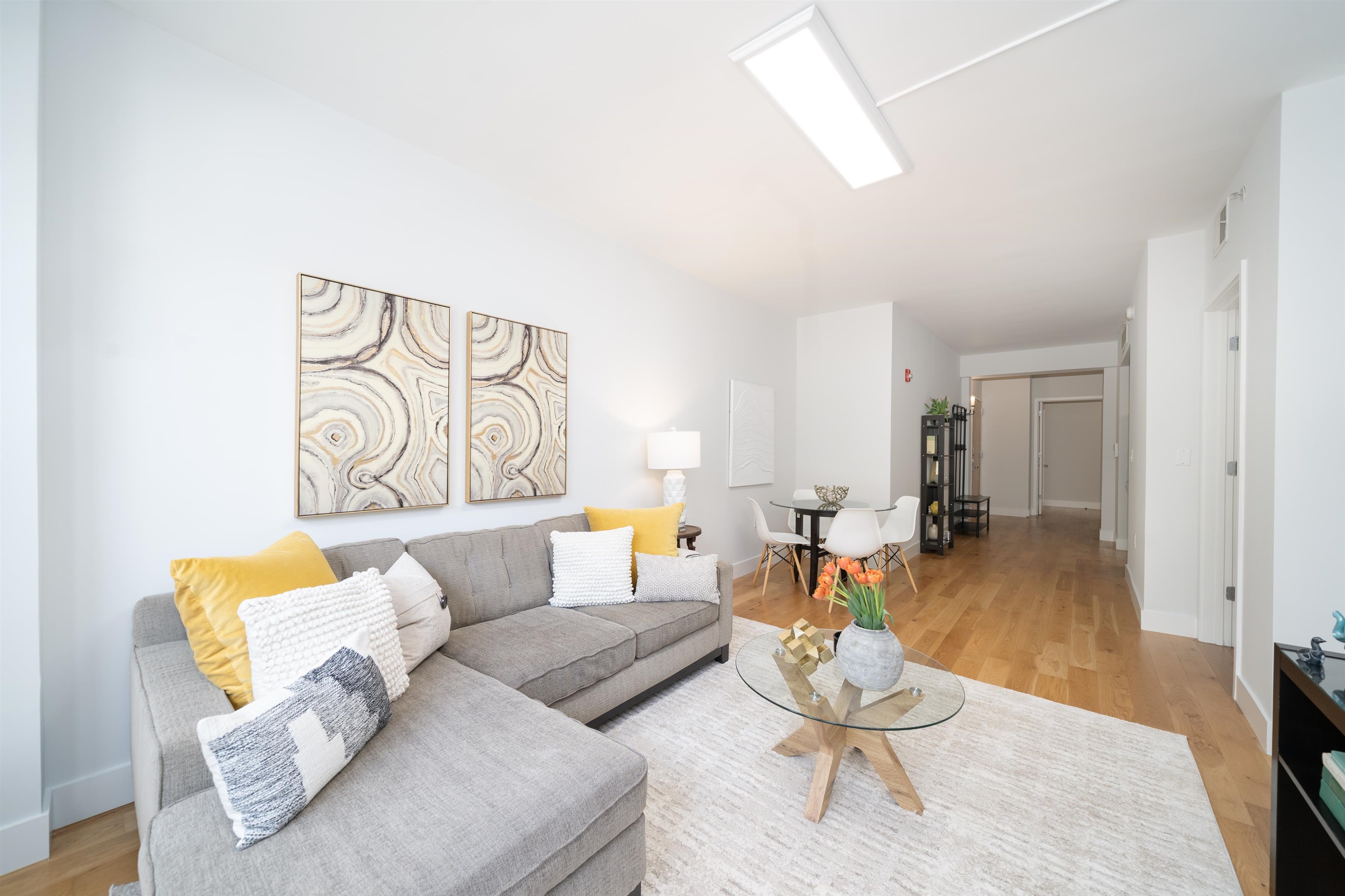 Welcome home to this spacious contemporary condo in Jersey City's most sought-after neighborhood, Historic Paulus Hook. This spacious 1-bedroom plus den (easily used as a windowless second bedroom) home offers 1, 056 sqft of modern living in the boutique Washington Pointe building. With only three units per floor, an elevator, and hardwood floors throughout, it's both private and stylish. The unit features a large living room that overlooks the historic Jersey City Post Office, a separate dining area and a large kitchen with granite counters, rich wood cabinets and stainless steel appliances. East facing windows fill the space with morning light. Both bedrooms can easily accommodate king sized beds and more! Other highlights include a walk-in closet, in-unit washer/dryer, extra storage in the basement, bike storage, and nearby parking 1 block away. Being in Paulus Hook gives you the luxury of having a short walk to a multitude of transportation options: 2 PATH stations (Exchange and Grove), a Citibike station 1/2 block away, Light Rail and the Paulus Hook ferry within a couple of blocks. The neighborhood features excellent public and private school options close by including top-rated (10 out of 10!) PS 16, the River School, Waterfront Montessori, McNair, and St. Peters Prep.