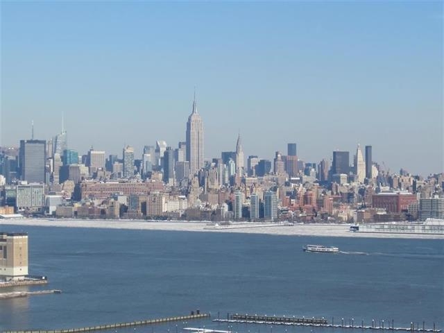 771 sq ft, E facing, spacious 1bed/1bath unit with unobstructed NYC and Hudson river view in a Luxurious A building.Unit features all hardwood floors throughout, floor to ceiling windows, Gourmet kitchen w/oversize granite island, SS appliances, maple cabinets, customized closets washer/Dryer and large balcony overlooking Manhattan. Building features 24hrs doorman, Gym, Outdoor patio BBQ area & community room.Close to all Path stations.Shops, Newport Mall, Restaurants, Parks schools are close by.1 car parking is included. Available Oct 1st.