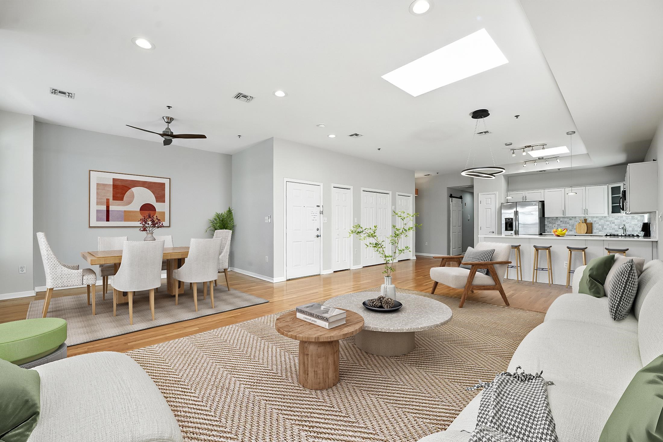 Spacious 2 BED/ 2 BATH (easily can be converted to 3 bedroom) 1452 SQFT home. Open concept layout offering a fully equipped chef's kitchen is a true highlight, boasting quartz countertops, custom newly refinished cabinets, with premium stainless steel appliancesall overlooking the sun-filled living and dining areas with brand-new skylights. The primary suite includes a walk-in closet, while additional features throughout the home include gleaming hardwood floors, a utility room with new appliances, pantry, new window screens, a recently upgraded rooftop air conditioner, and water heater. One indoor deeded parking space with generous storage is included. A newly installed app-based video access system provides convenience and peace of mind. Perfect for entertaining, this home offers a private 10' x 15' roof deck accessed by an internal staircase. Enjoy NYC skyline views under a custom IPE wood pergola, all set atop a roof renewed in 2019 with a 20-year warranty. Located just 2 minutes from the 2nd Street Light Rail station, this property blends modern upgrades, comfort, and unbeatable accessibility.