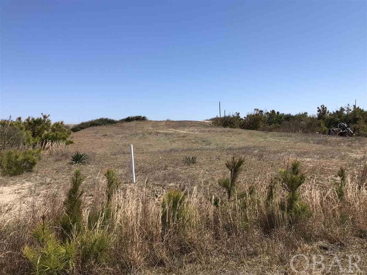 This is your opportunity to own over 2.25 ACRES of semi oceanfront land in the 4x4 area of Carova Beach!  This is the equivalent of almost 7 typical 1/3 acre lots in the 4wd area.  Such a beautiful piece of property that you can build you beach house on and still have plenty of privacy.  The Atlantic Ocean is right across the road for easy beach access and excellent views.  There is an extraordinary amount of sand material on this lot.  You essentially are buying an entire block.  If you are looking for paradise and elbow room, this is your unique opportunity to do it now!