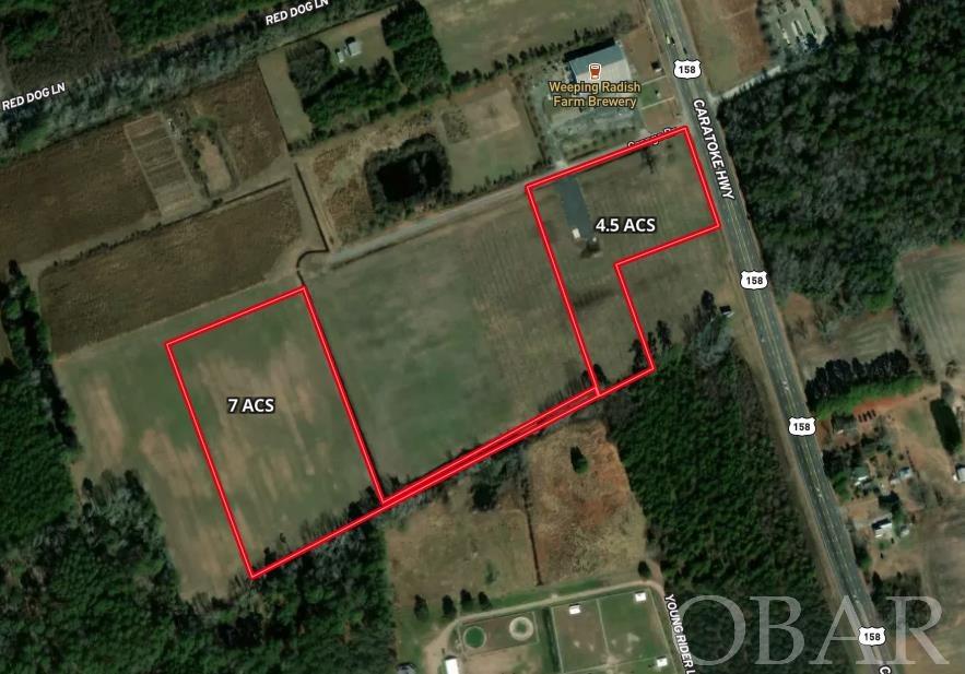 Great commercial  location between Weeping Radish & Cotton Gin in Grandy.  A great price in this rapidly growing area.     Corner lot with excellent visibility and access.  Rare zoning of light manufacturing that allows many usages that general business does not allow.    Broker has ownership interest.