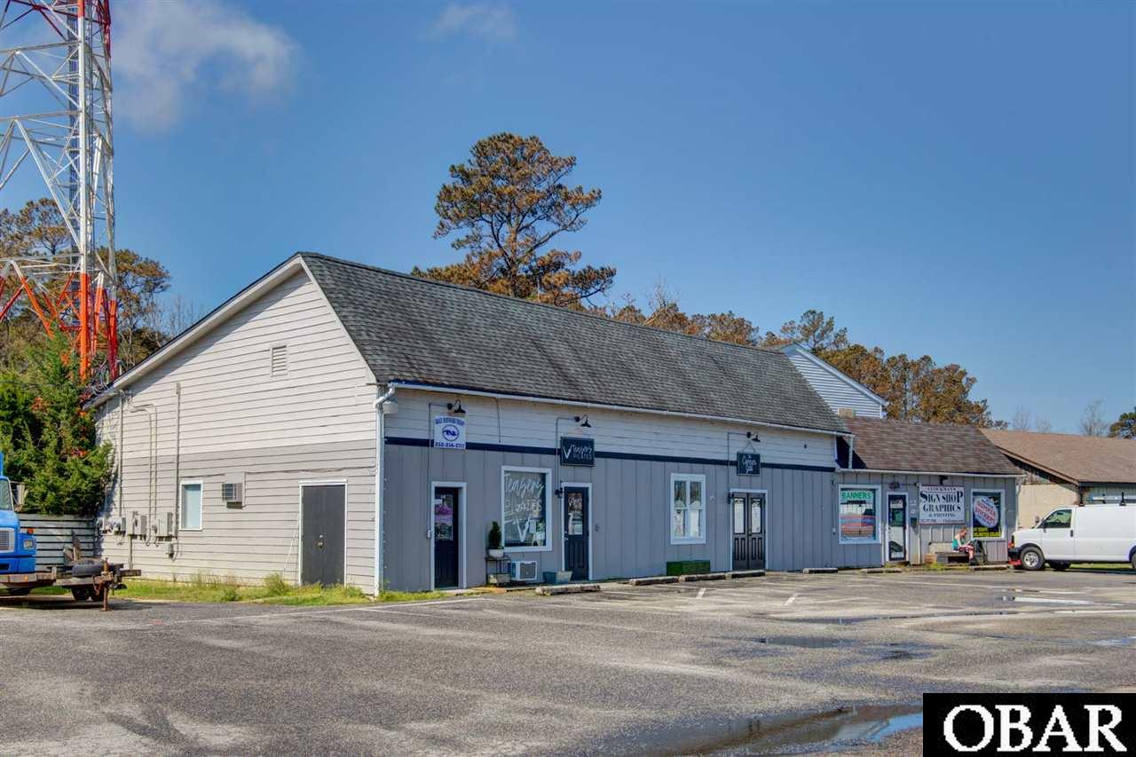 INVESTMENT OPPORTUNITY OR OWNER/USER! Plus there is additional area on the second floor that should accommodate an apartment to further increase cash flow, when completed. Being next to RD Sawyer Motor Company and across the street from Manteo Marine, and with high visibility on Hwy 64/264, ample parking, there should never be an issue to keep the property fully leased. A good mix of tenants, creates traffic for all occupants. Two of he tenant have been there for years. The tower lease is not part of the sale.