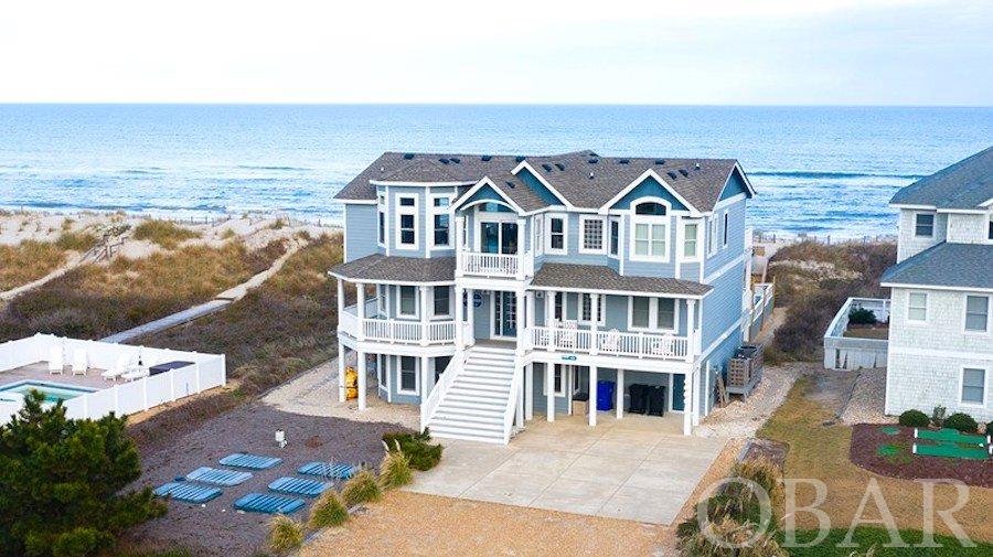 OVER $200K IN RENTAL INCOME! Beautiful oceanfront in north Duck with sweeping views. A sound investment with great rental income, the home consistently generates about $200,000 in income each year. New roof in 2017, New carpet in 2021, new peat septic in 2019. Enjoy the pleasures of an oceanfront home with plenty of wide sandy beach at your doorstep in addition to a spacious floor plan, spectacular views, and tasteful furnishings. Equipped for fun and meticulously maintained, this investment home offers a host of amenities including 4 master suites, an elevator, theatre room, game room, and private heated pool and hot tub. View drone footage here! https://youtu.be/1yRYU2eByY0