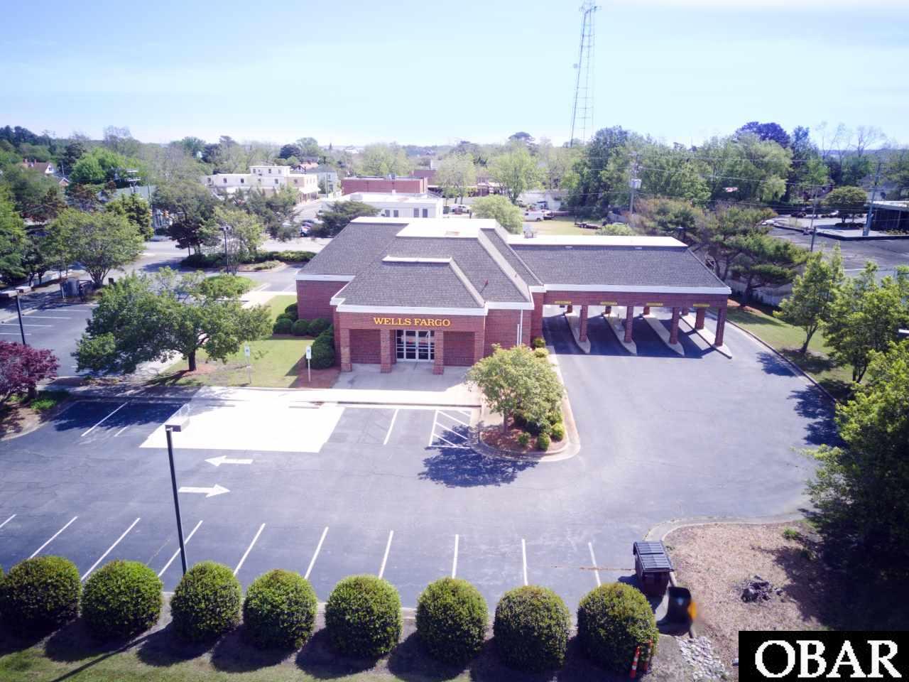 This 1.85 property is located in the heart of Manteo on Roanoke Island in Dare County. The property is comprised of two parcels, the larger 1.22 acres and .63 acre. Property has an ideal location for visibility and access located on Hwy 64/264. Zoned B-1 to allow for traditional business activity. Current use is a Bank Branch that has been well maintained, with site improvements to include, 4 lane drive through, 37,500 SF parking lot over the two sites with 57 marked spaces. Close proximity to downtown Manteo, College of the Albemarle campus as well as Dare County's County  Complex.