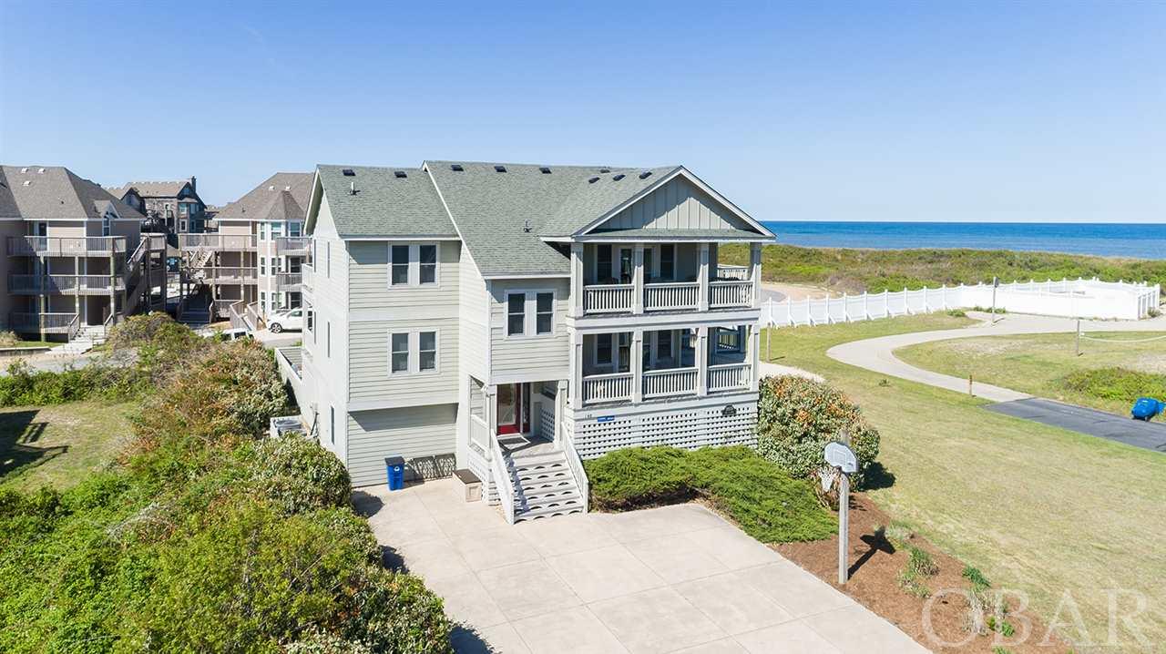 2021 Rents already OVER $150,OOO and on track to do OVER $170,000!  This Beautiful 6BR 5.5BA Semi-Ocean Front home has Great Ocean Views and is in the X Flood Zone which means No Flood Insurance Required.  The top floor Great Room has a Well Appointed Kitchen With Granite, Island Bar with Seating for 5 and Stainless Appliances. The Living Room with Gas Fireplace, Multiple Dining and  Additional Seating areas are Surrounded by Windows to really take advantage of the Great Ocean Views. A Master Suite and several Covered and Open Sun Decks finish off the top floor.  5 more bedrooms, a Game Room with Pool Table and full Wet Bar, Several Comfortable and Separate Seating Areas provide the room for even a large family to find somewhere to Relax, Read or Recreate.  Outside you will find a Beautiful Yard with an In Ground Pool, Hot Tub, Basketball and Volley Ball Court. Beach Access is just a Few Short Steps Away.  For Location, Views, Amenities and Income, "LIFE IS GOOD" is GREAT!
