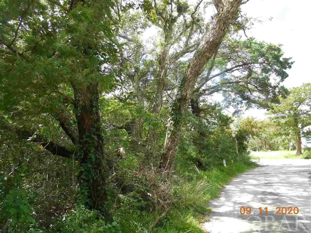 A 6,608 sq. ft. lot on Martha Jane Lane. Located off Lighthouse Rd, convenient to Springer's Point Preserve, shops, restaurants and Silver Lake harbor. The historic Ocracoke Lighthouse is across the street. This property has many mature trees and is located on a cute village lane. Conveys with a 3 bedroom septic permit. No restrictive covenants. Taxes shown are for all 3 parcels.