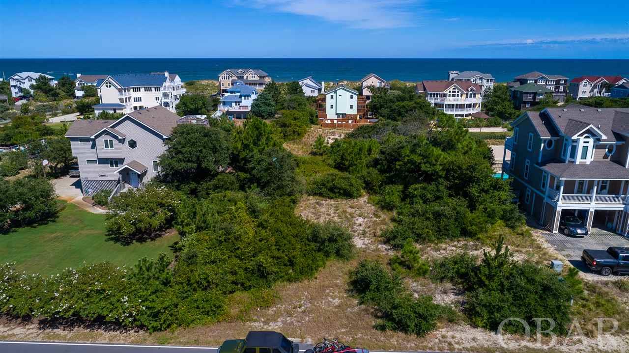 Ocean Views ! Located 2 Lots Ocean Front in Flood Zone X.  Large Whalehead  20,000 SqFt Vacant Lot ( almost 1/2 acre) . Quick beach access, situated 2 lots to the corner walkway to access the beach.  This Vacant Lot is closer to the beach access than some Semi-Oceanfront lots and considerably less expensive.  If highest and best use of this property is maximized, the income potential is great.  Currently, there  are not many lots available for sale in Whalehead.  This lot offers an additional opportunity, as the seller has also listed the semi-oceanfront home that is directly in front (east) of this lot with the address of 1018 Lighthouse Drive. Purchasing the lot and the house would offer an additional "privacy buffer" and/or the opportunity to develop the Vacant Lot at 1019 Whalehead as you see fit. See the MLS Listing for 1018 Lighthouse Drive to learn more about this home and the opportunity to increase your privacy.