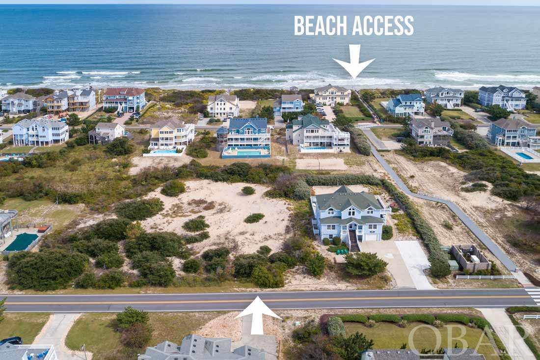 Look no further, this is the lot you have been waiting for! Almost 1/2 acre X Flood Zone close to the beach! Build your dream custom beach home on one of the nicest oceanside lots available in the Northern Outer Banks. This desirable 3rd row Whalehead homesite is located only one lot from the corner, with a pedestrian walkway straight to the beach! The ocean is just a short easy walk and your beach access is a breeze. Enjoy the beautiful, wide uncrowded beaches in one of Corolla's favorite neighborhoods. Large homesites such as this are a rare find, offering privacy and plenty of room for a larger home and outdoor spaces. The high elevation of this homesite should provide lovely ocean views in your future home. This property is a MUST SEE! Act quickly, priced to sell.