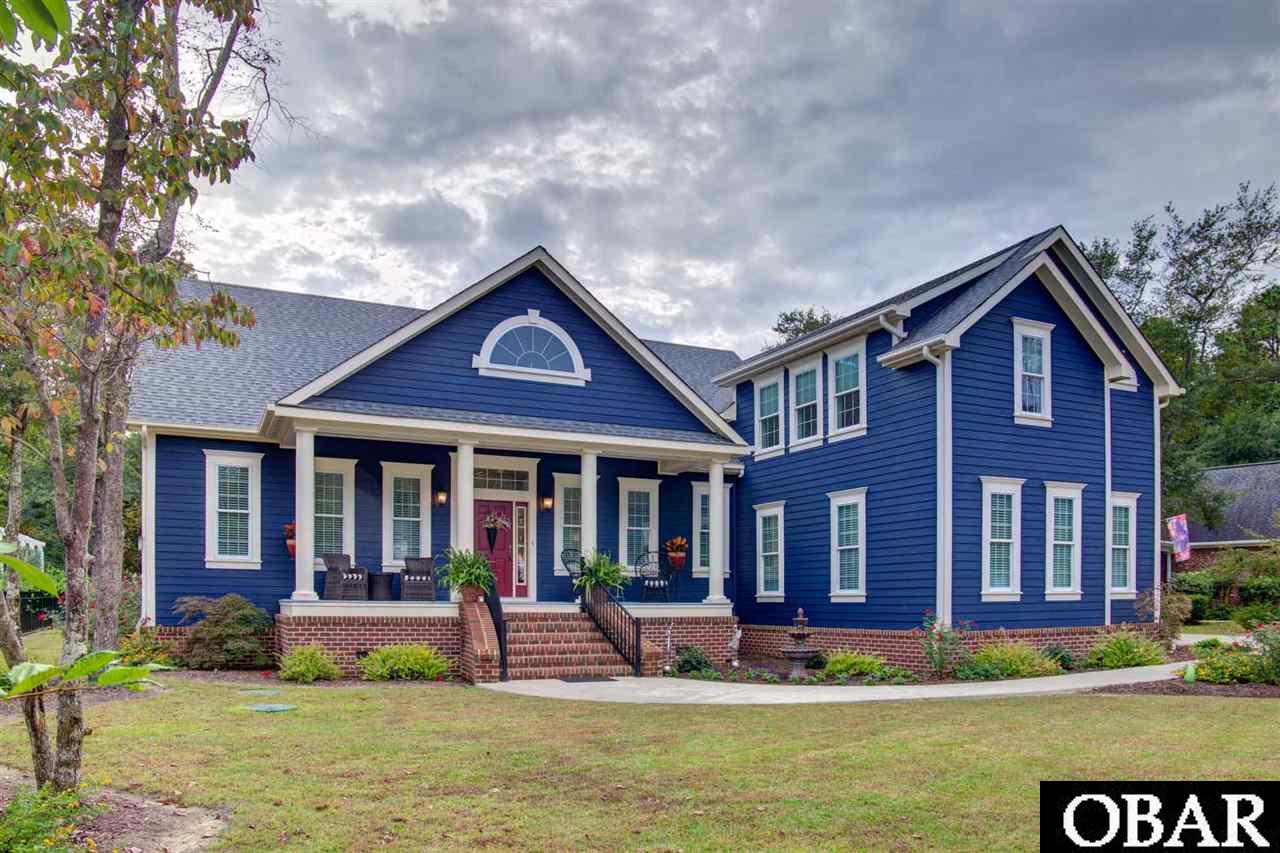 Stunning Custom Home built in 2018 and impeccably designed for Single Story Living in the Sound front community of Heritage Point!  This beautiful property offers over 3000 heated sq. ft. PLUS an 1150 sq. ft. unheated Walk-in Attic space that could easily be converted to additional bedrooms or bonus living space!  The gorgeous entry path welcomes you to a Southern style covered front porch entrance into the main level.  Your eyes are immediately drawn to the 10' coffered ceilings throughout the kitchen, dining and main living areas as well as the transom windows, 3 piece crown molding and warm bamboo hardwoods that make this home so welcoming.  Built for entertaining, the chef in your group will love the top of the line GE Cafe Appliances including a gas top range with 2 ovens, and oversized Quartz Island with an open view into the Dining area, Sitting area, and main Living area.  The main level also offers an Office, Powder Room, main Master Suite with his and her walk in closets and stunning en suite bathroom, and a 2nd Bedroom also with private en suite bath.  No detail was spared with UV blocking custom built in living room blinds, bedroom darkening shades, central vacuum, on demand hot water heater, roll out kitchen shelves and even a hidden coffee bar.  The large Laundry room off the Kitchen also has numerous built in shelves for the perfect walk-in pantry.  Upstairs you will find a large 3rd Bedroom, which also has plenty of space to be used as a bonus room, and you will find steps leading to the walk-in Attic space off this area.  There is no lack of storage in this home with a finished (including trim work!) 2 car garage with an epoxy floor and additional storage nooks, cubbies, and a sink.  The outside was designed to be your personal oasis with an automatic awning (with wind sensor!), patio, sun deck, landscaping with irrigation off a deep well and low voltage lighting, outside shower with urinal, and a 12' x 12' wired shed.  You will enjoy all that Heritage Point offers from the private community boat dock and ramp to the individually assigned boat slip for each owner and sound access, as well as a community clubhouse and tennis courts!  Serenity awaits you at 102 Weir Point Drive!
