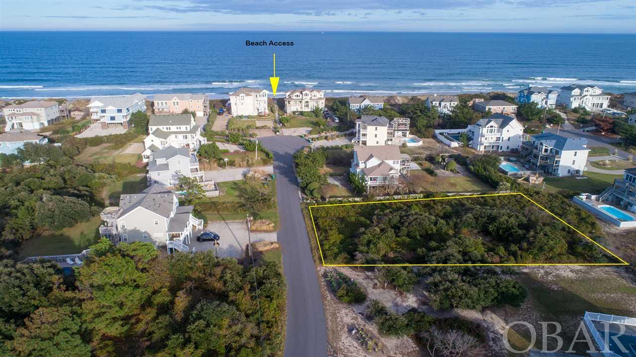 Super Opportunity - Beautiful Oceanside lot in highly desirable Section B of Ocean Sands. Large lot, over 20,000 sq. ft. and only 350 ft. to direct beach access! New home built on this lot will have good ocean views and easy access to the best beaches on the Northern Outer Banks. The location is excellent  - convenient to local shops, restaurants and attractions. This lot is comparable to a  3rd row corner lot in Whalehead. This is the one you have been waiting for - take advantage of super low interest rates and build that special beach home that you have always wanted.