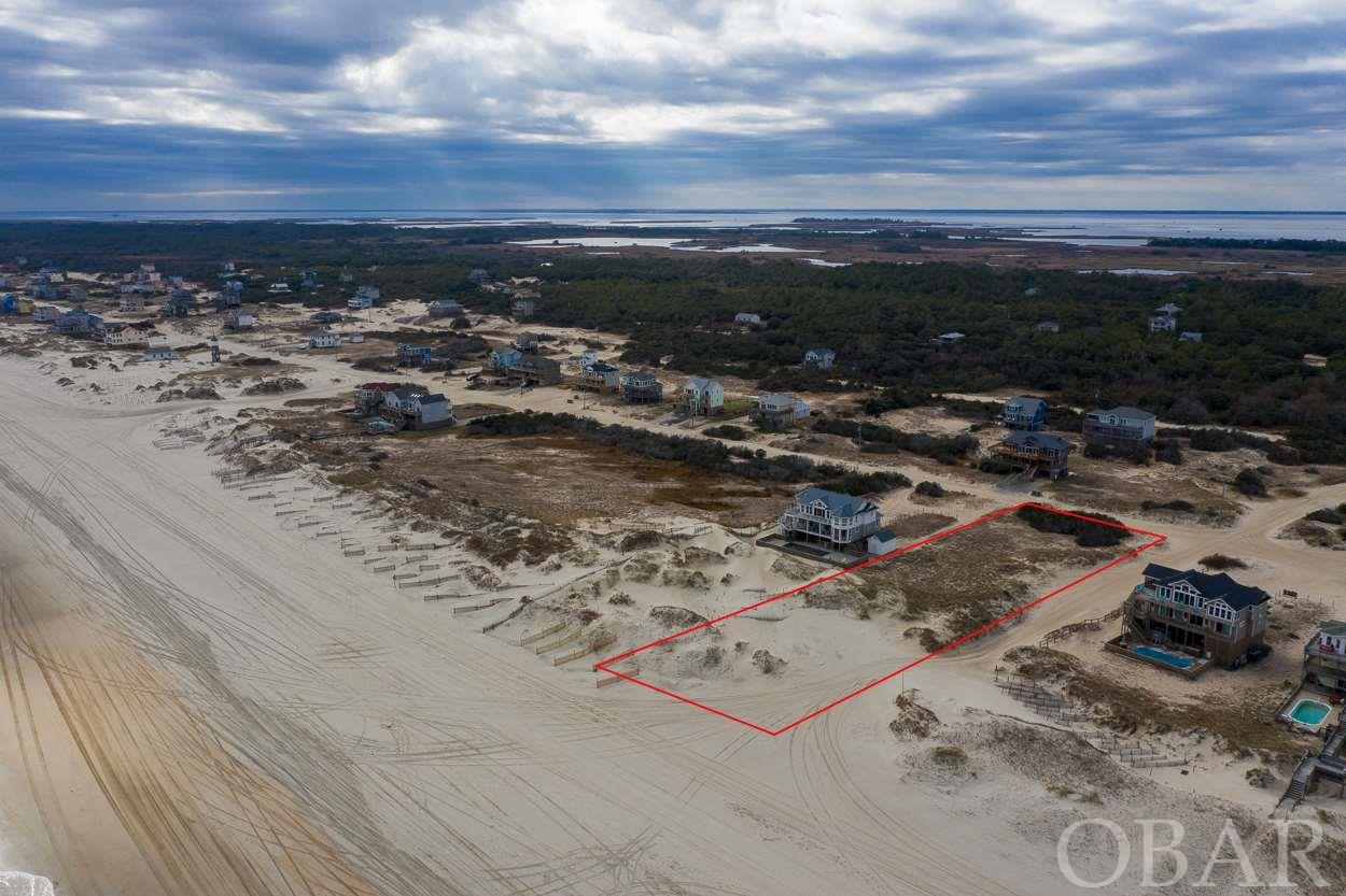 Beautiful oversized Oceanfront lot in North Swan Beach! Extra large with 95 ft on the water and 156 ft on the sand road. Enjoy the peacefulness of the 4x4 off road area where the wild Mustangs roam. Approximately 6 miles to all that Corolla's paved area has to offer. If you can dream it, you can build it. Build in the X flood zone, no flood insurance required. Recently completed survey and soil test  available.